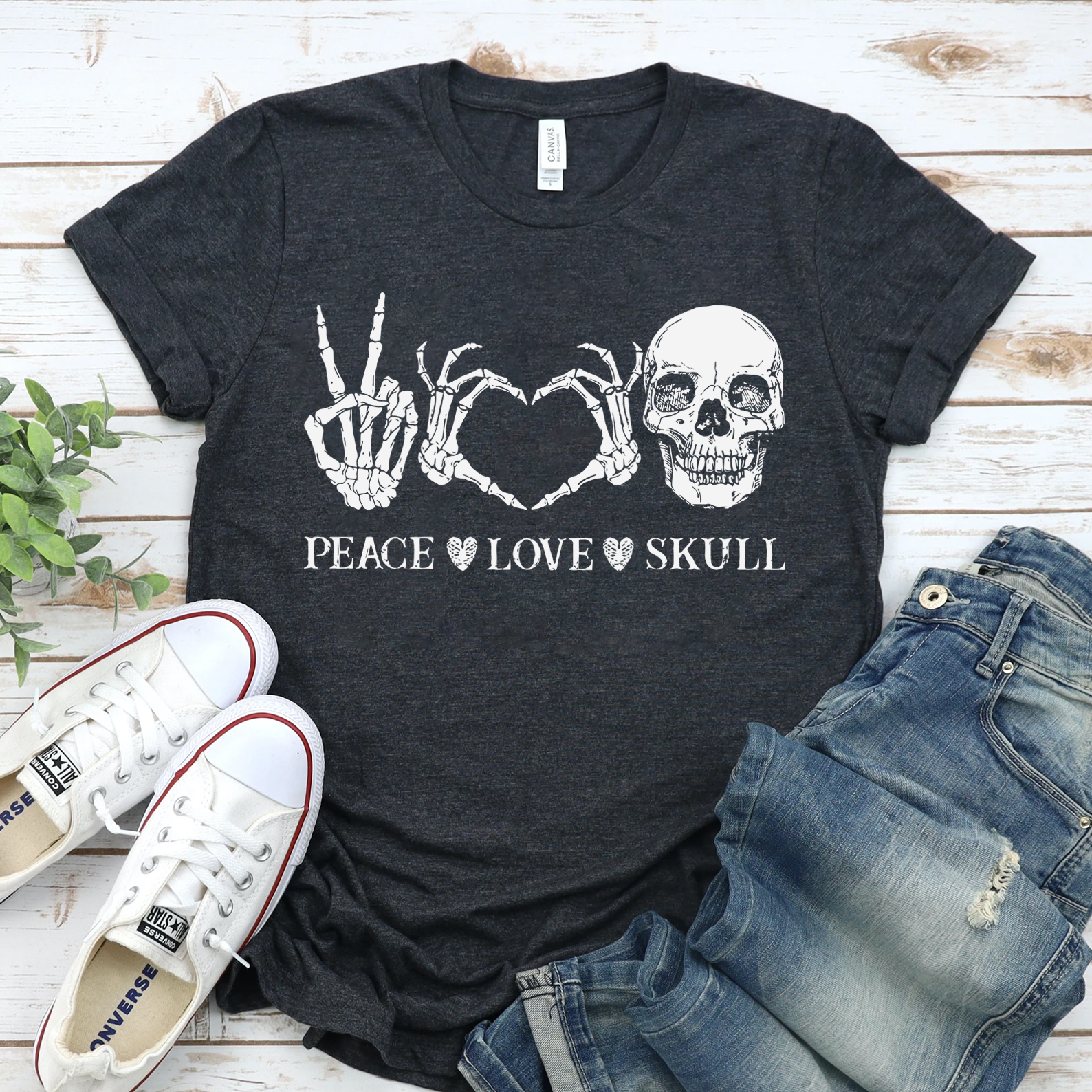 Peace Love Skull Halloween T-shirt featuring a vibrant skull design on premium cotton fabric.