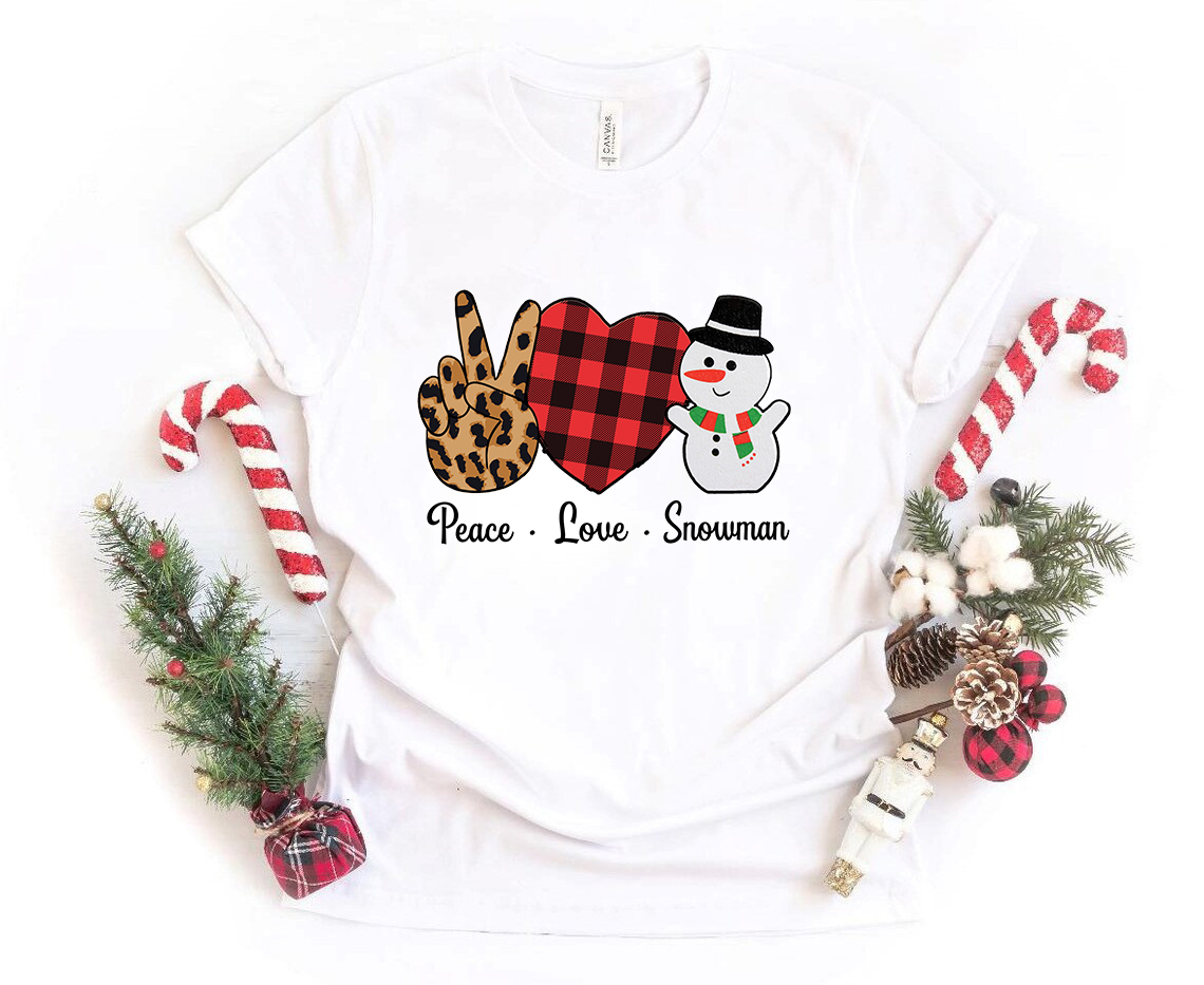 A cozy unisex T-shirt featuring a festive snowman design, made from soft ring spun cotton, available in multiple colors.