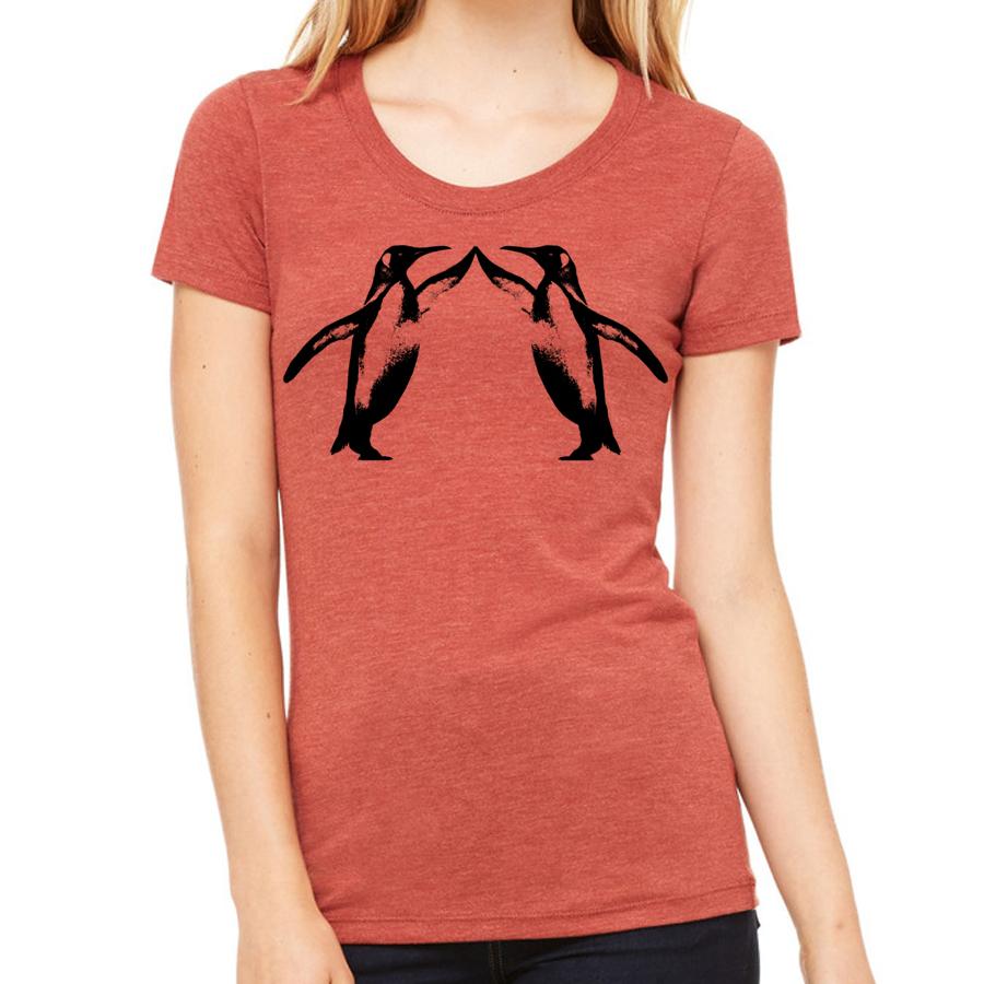 A playful t-shirt featuring a cute penguin graphic giving a high five, perfect for animal lovers.