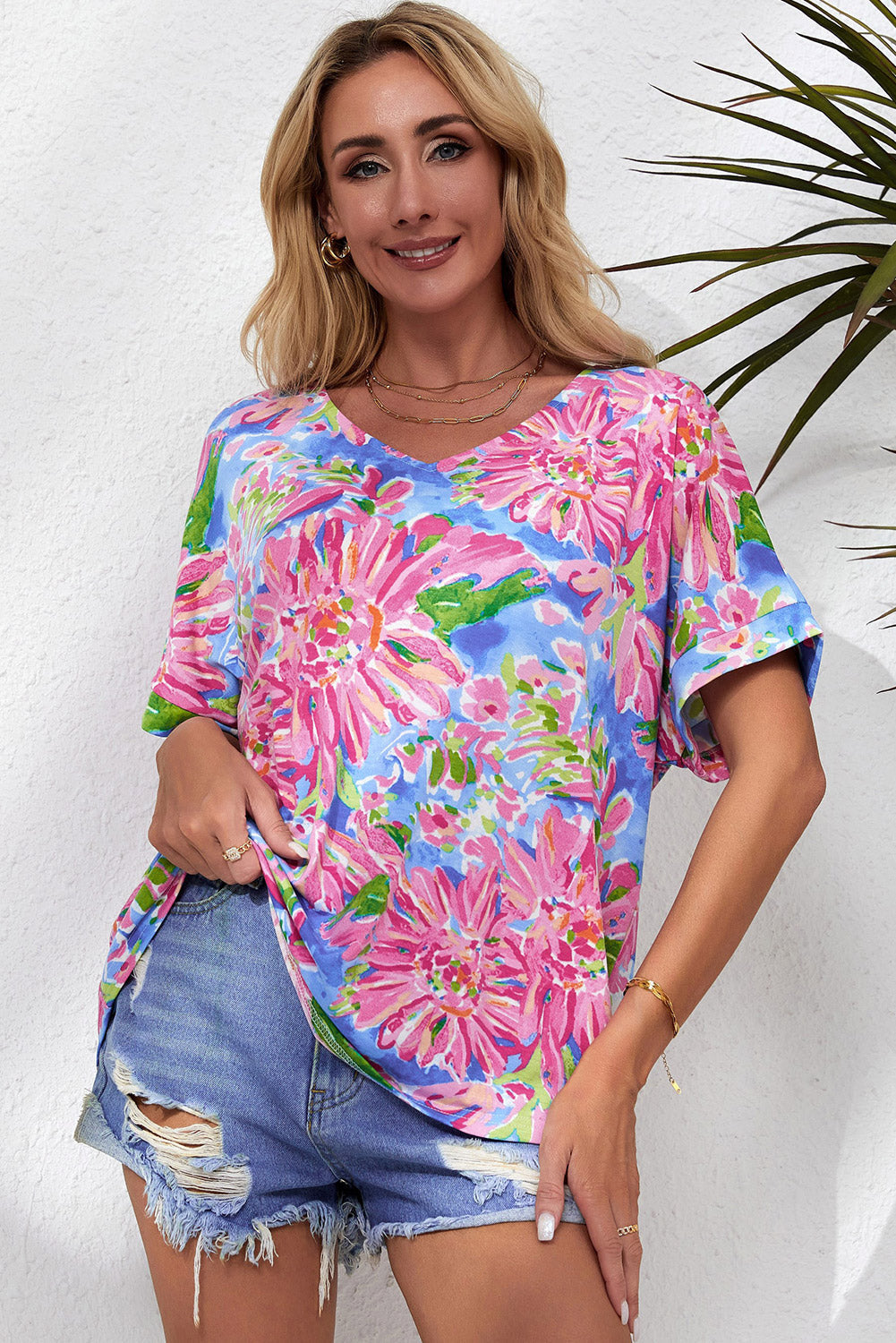 A stylish Pink Floral Print V Neck T Shirt featuring a loose fit and short sleeves, perfect for summer wear.