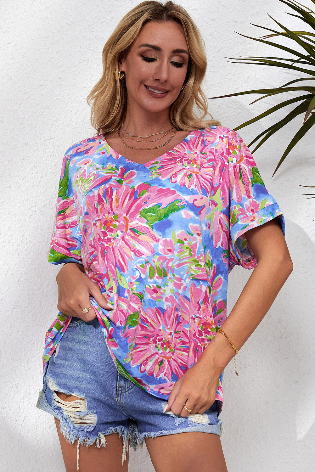 A stylish Pink Floral Print V Neck T Shirt featuring a loose fit and short sleeves, perfect for summer wear.