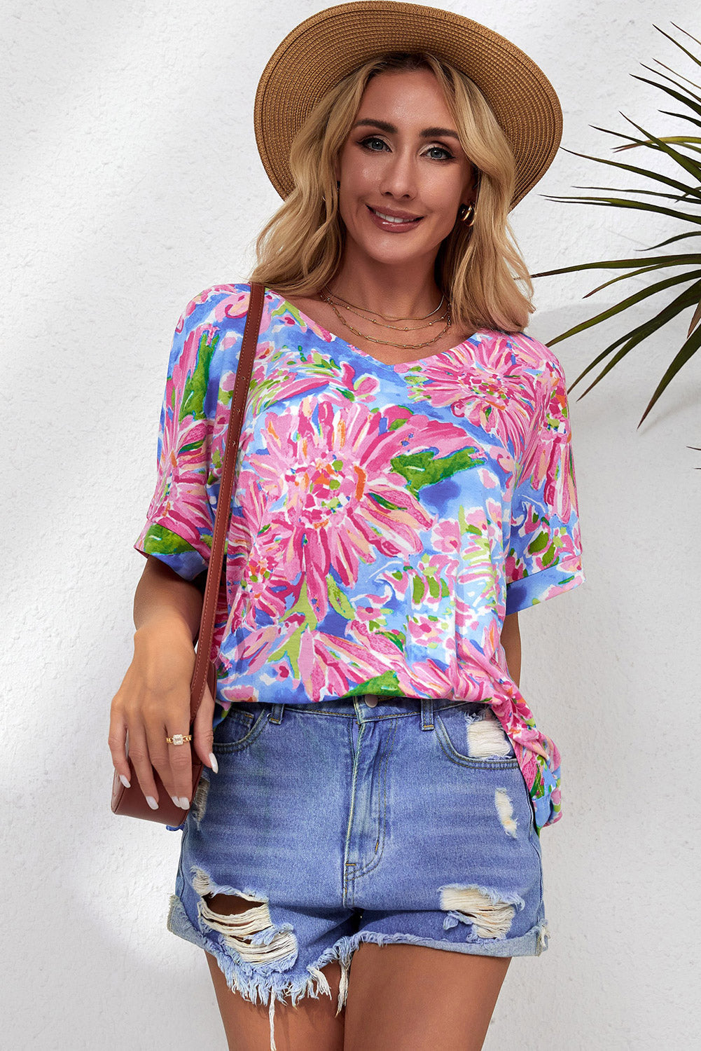 A stylish Pink Floral Print V Neck T Shirt featuring a loose fit and short sleeves, perfect for summer wear.