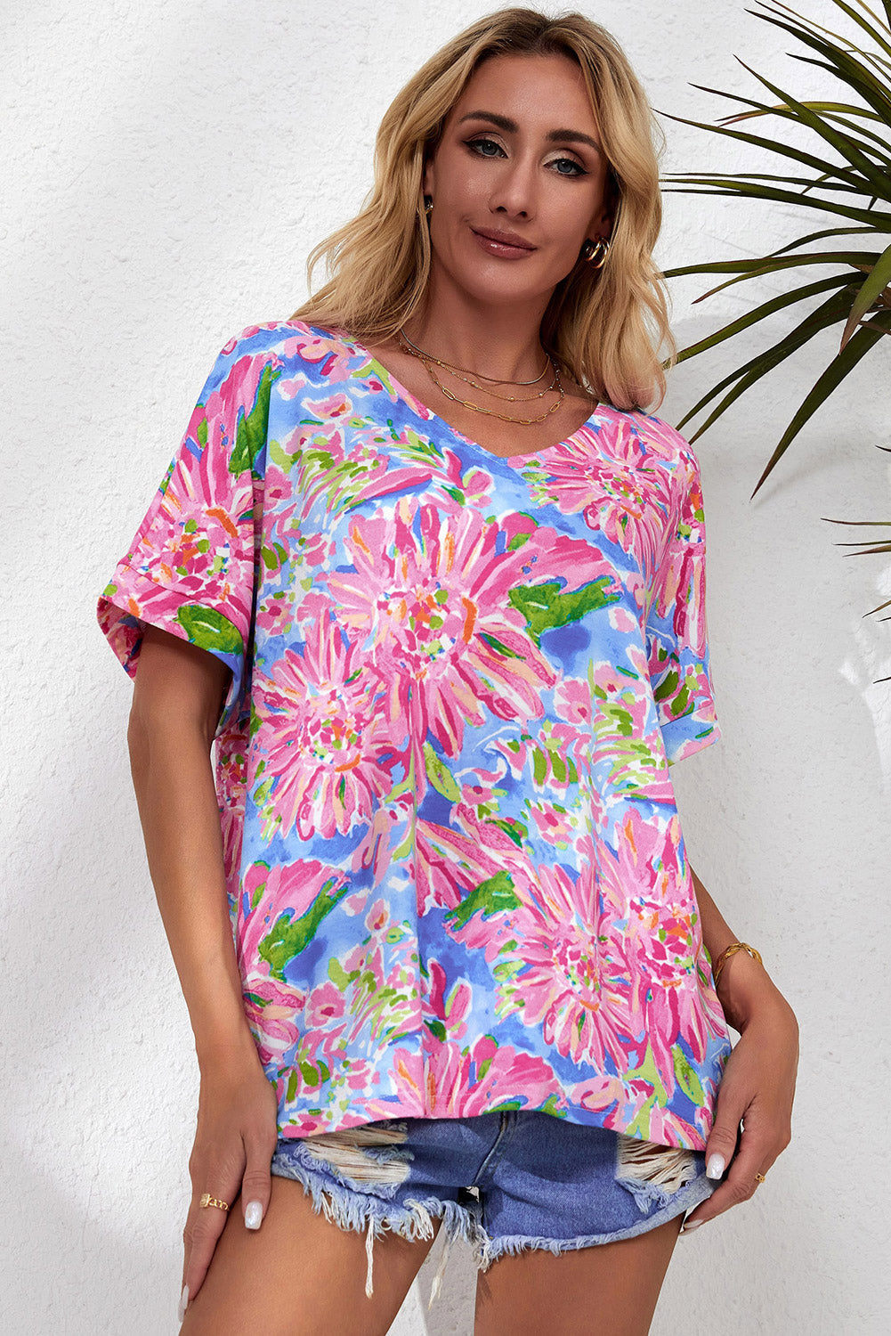 A stylish Pink Floral Print V Neck T Shirt featuring a loose fit and short sleeves, perfect for summer wear.