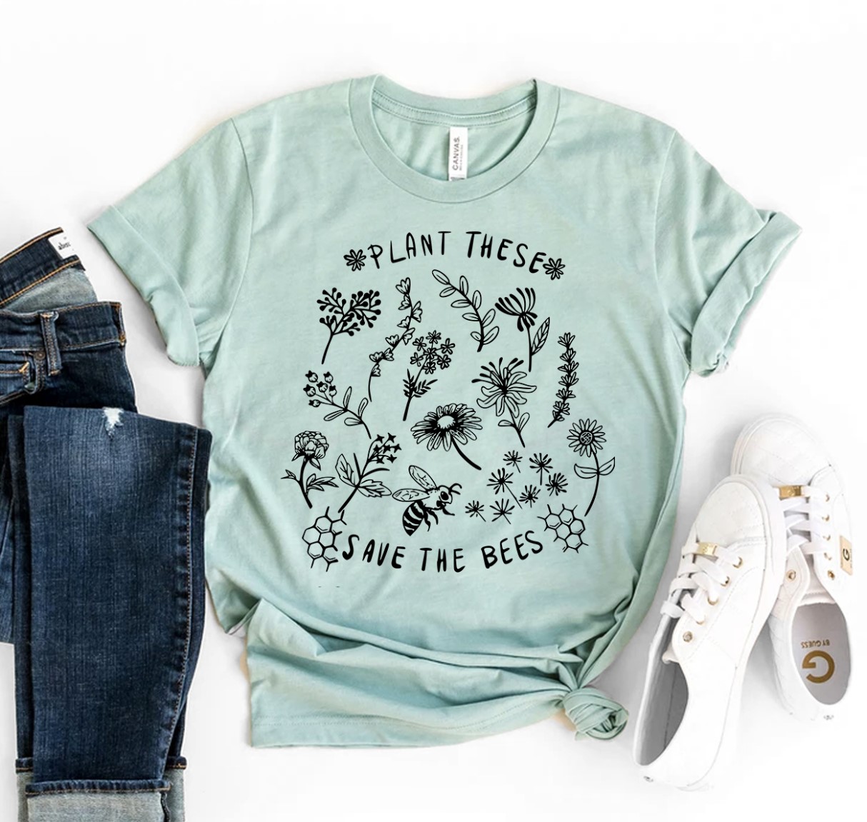 A stylish Plant These Save the Bees Shirt made from premium ring spun cotton, featuring a vibrant print promoting bee conservation.