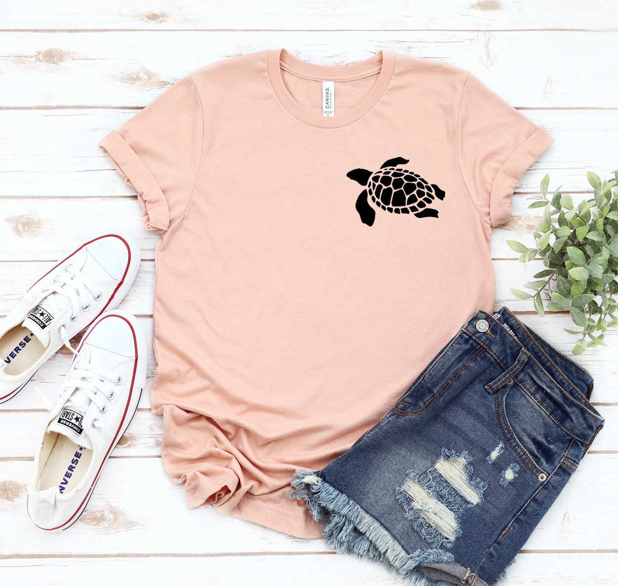 A stylish Pocket Turtle T-shirt made from soft airlume combed cotton, featuring a classic unisex design in various sizes.