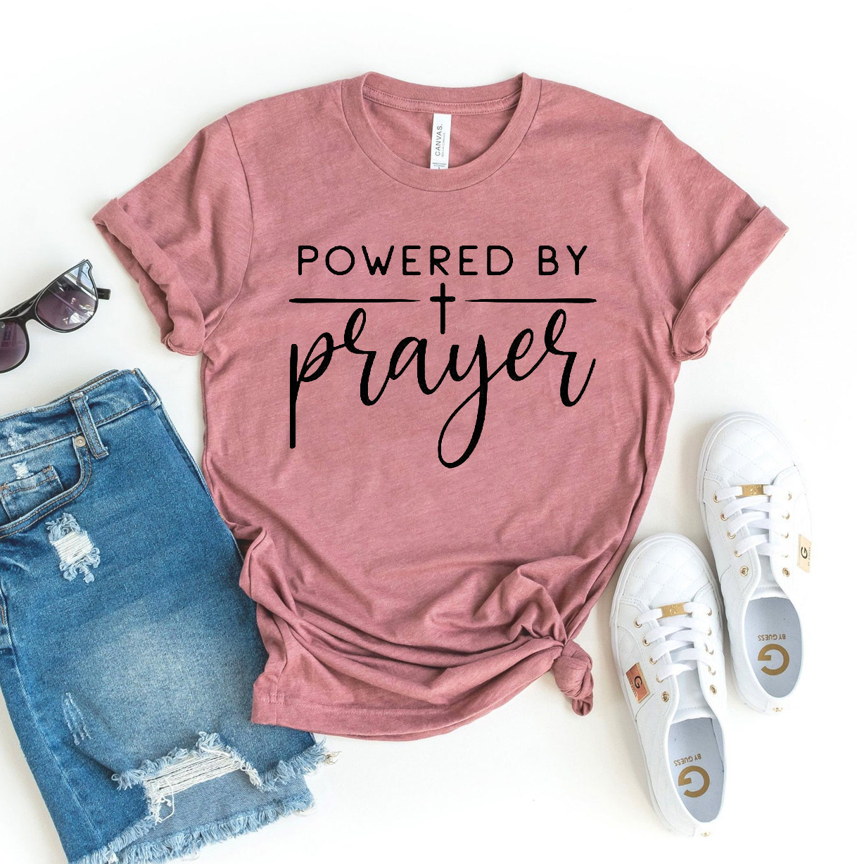 A stylish Powered By Prayer T-shirt made from premium ring spun cotton, featuring a vibrant flex print design.