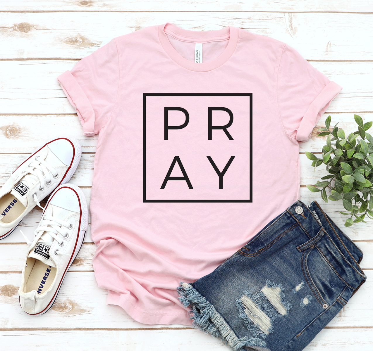 A classic unisex Pray T-shirt made from soft airlume cotton, showcasing its comfortable fit and stylish design.