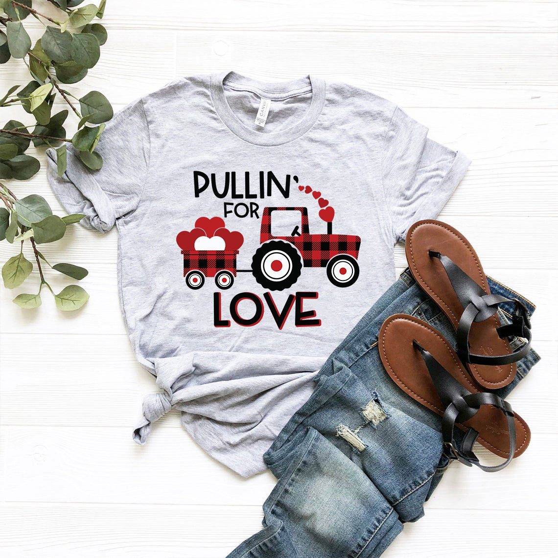 Pulling For Love Shirt in various colors, showcasing its unisex design and soft fabric.