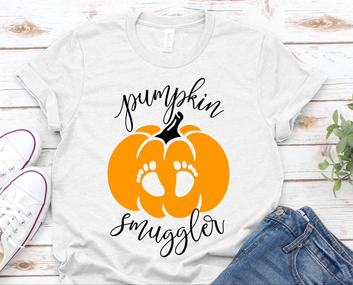 Pumpkin Smuggler Halloween T-shirt made of premium ring spun cotton with a striking design, perfect for Halloween celebrations.