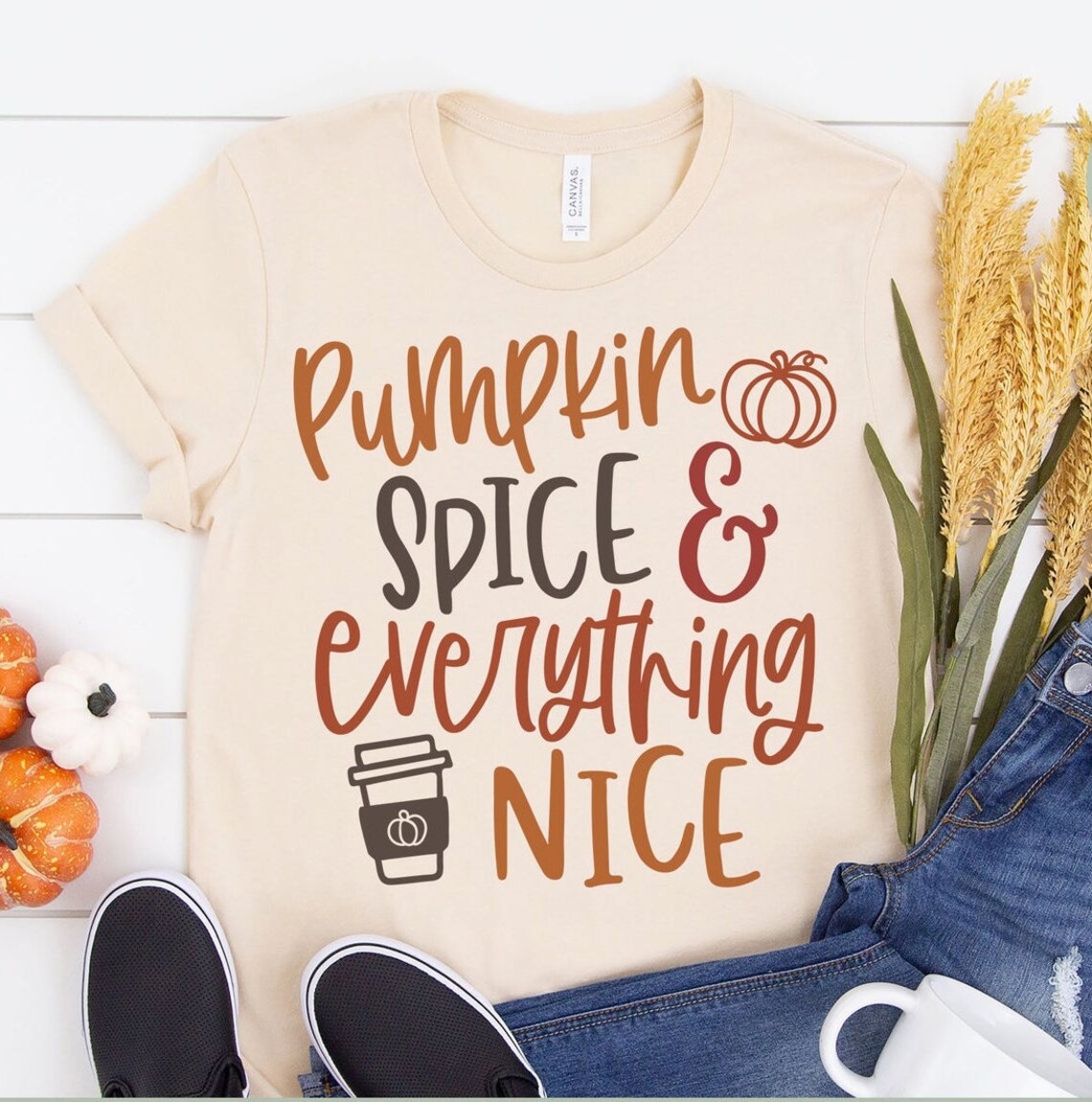 Pumpkin Spice Everything Nice Halloween T-shirt featuring vibrant autumn colors and a playful design, made from soft ring spun cotton.