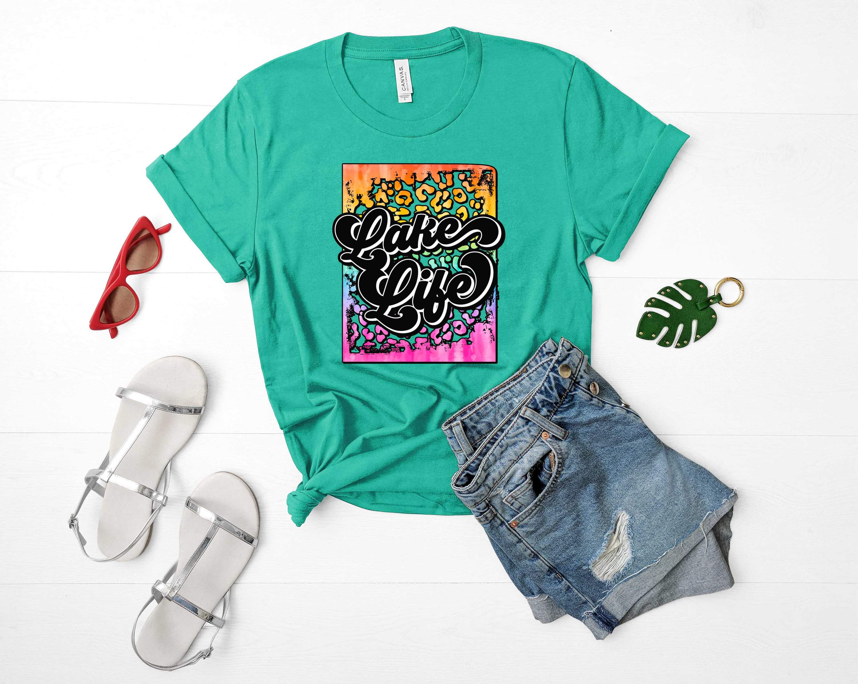 A vibrant unisex graphic tee featuring a colorful rainbow lake design, perfect for casual wear.