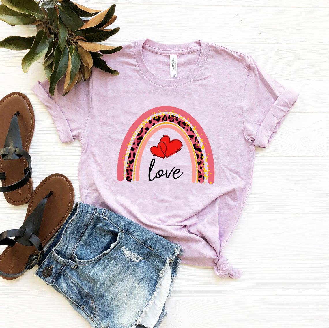 A colorful unisex Rainbow Love Shirt made from soft ring spun cotton, showcasing its vibrant colors and comfortable fit.