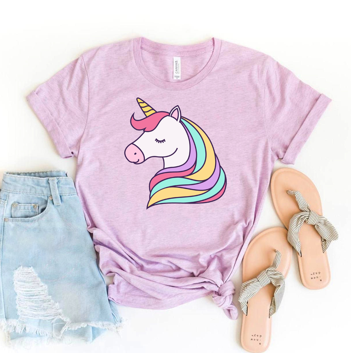 A colorful Rainbow Unicorn T-shirt made of soft ring spun cotton, featuring a vibrant unicorn design.