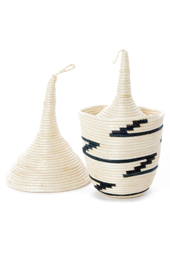 A beautiful set of five handcrafted Rwanda nesting baskets made from natural sisal, showcasing unique designs in shades of black and dark blue.