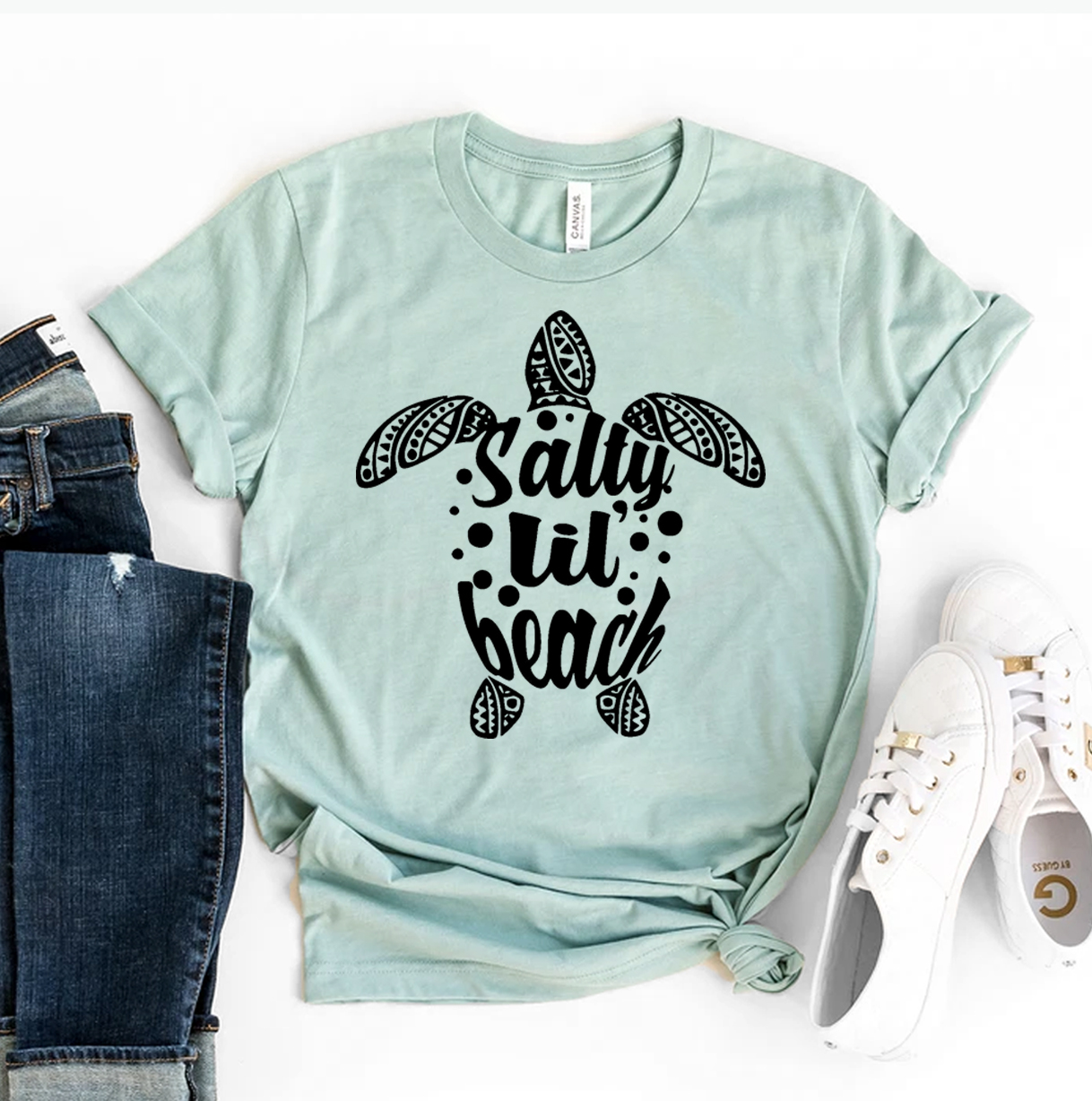 Salty Lil Beach T-shirt made of premium ring spun cotton with vibrant flex print design, available in various sizes.