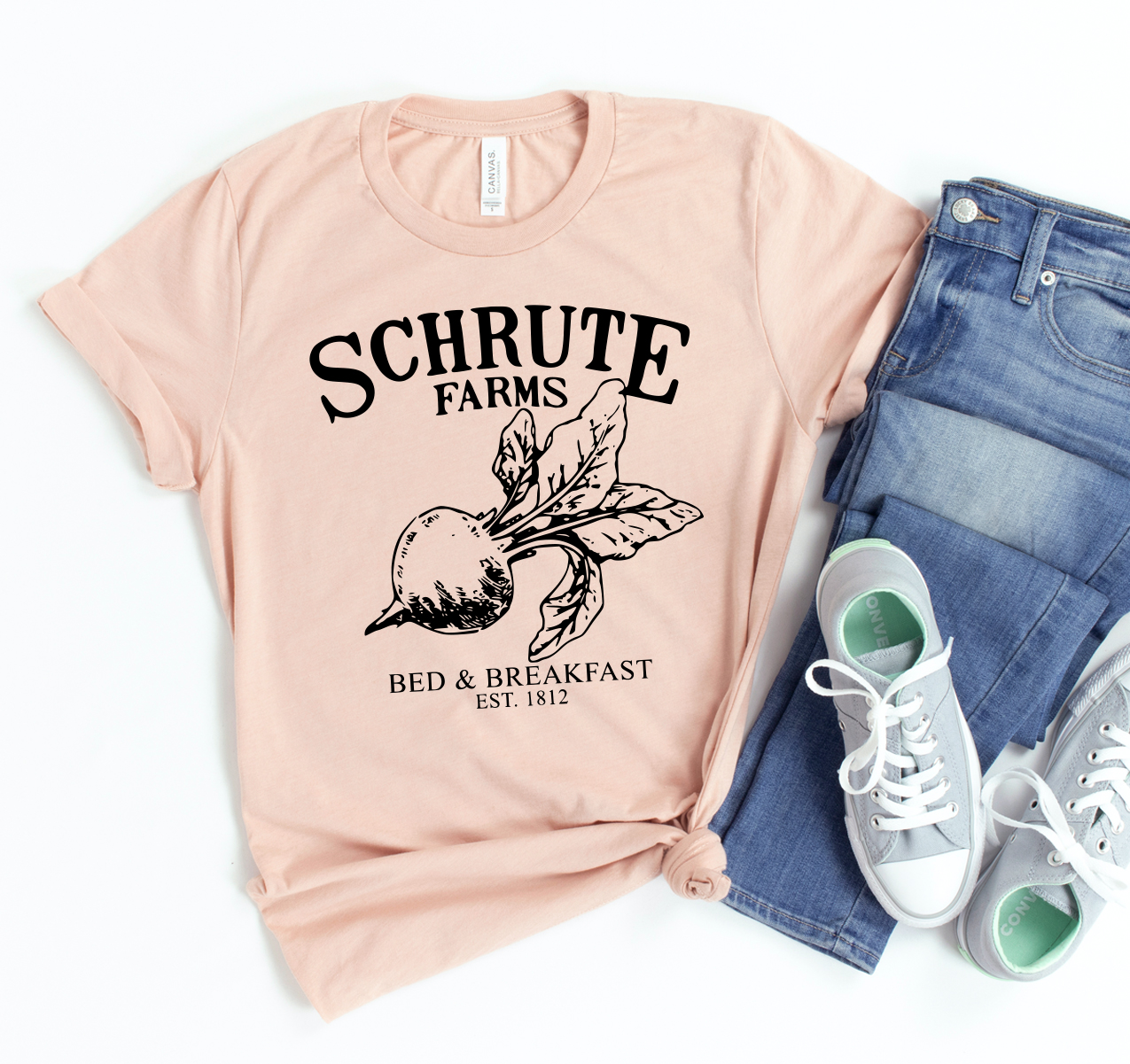 Schrute Farms T-shirt featuring a classic unisex design in soft airlume combed cotton, available in various sizes.