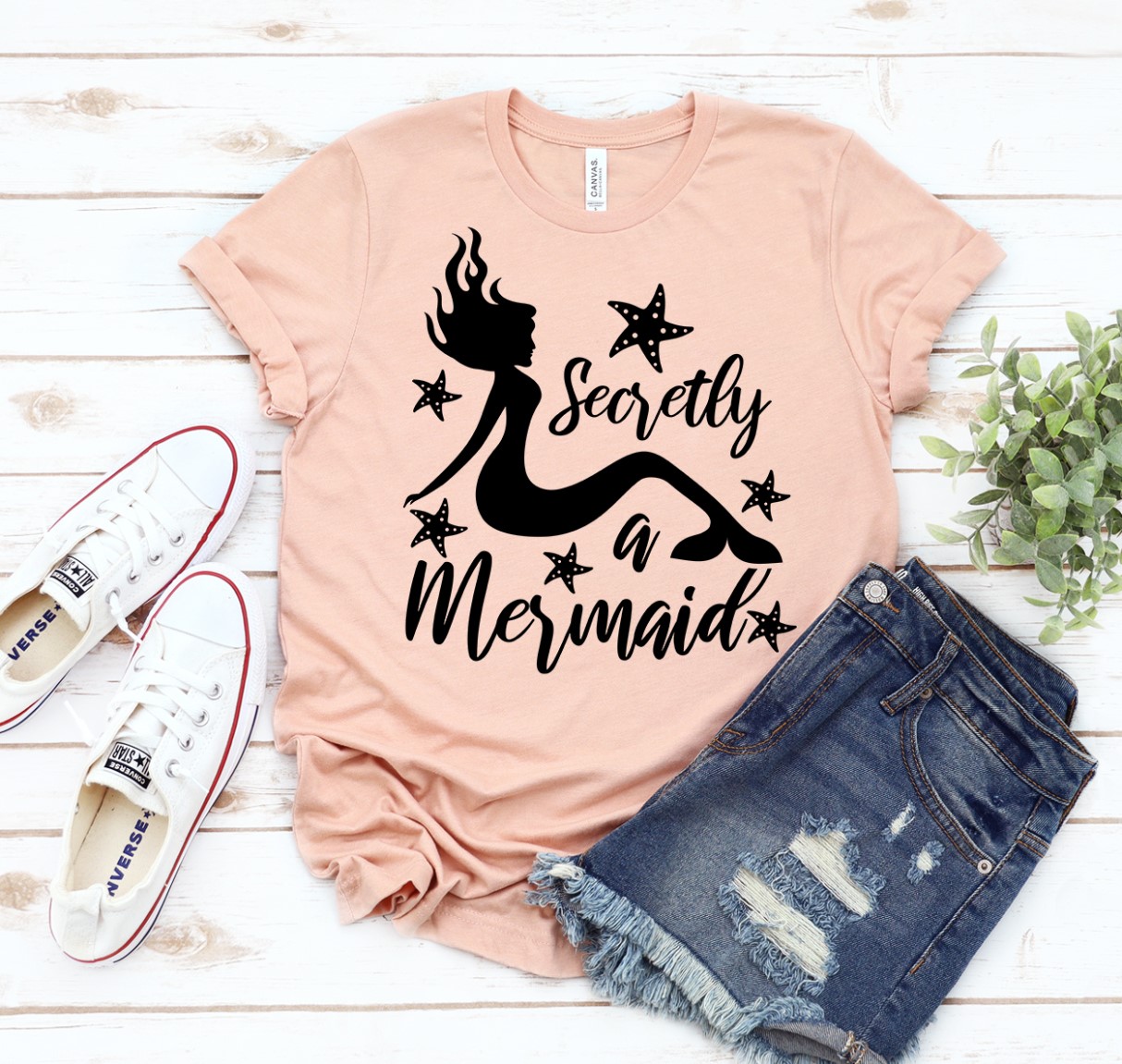 A stylish Secretly a Mermaid T-shirt made from premium ring spun cotton, featuring a vibrant mermaid-themed design.