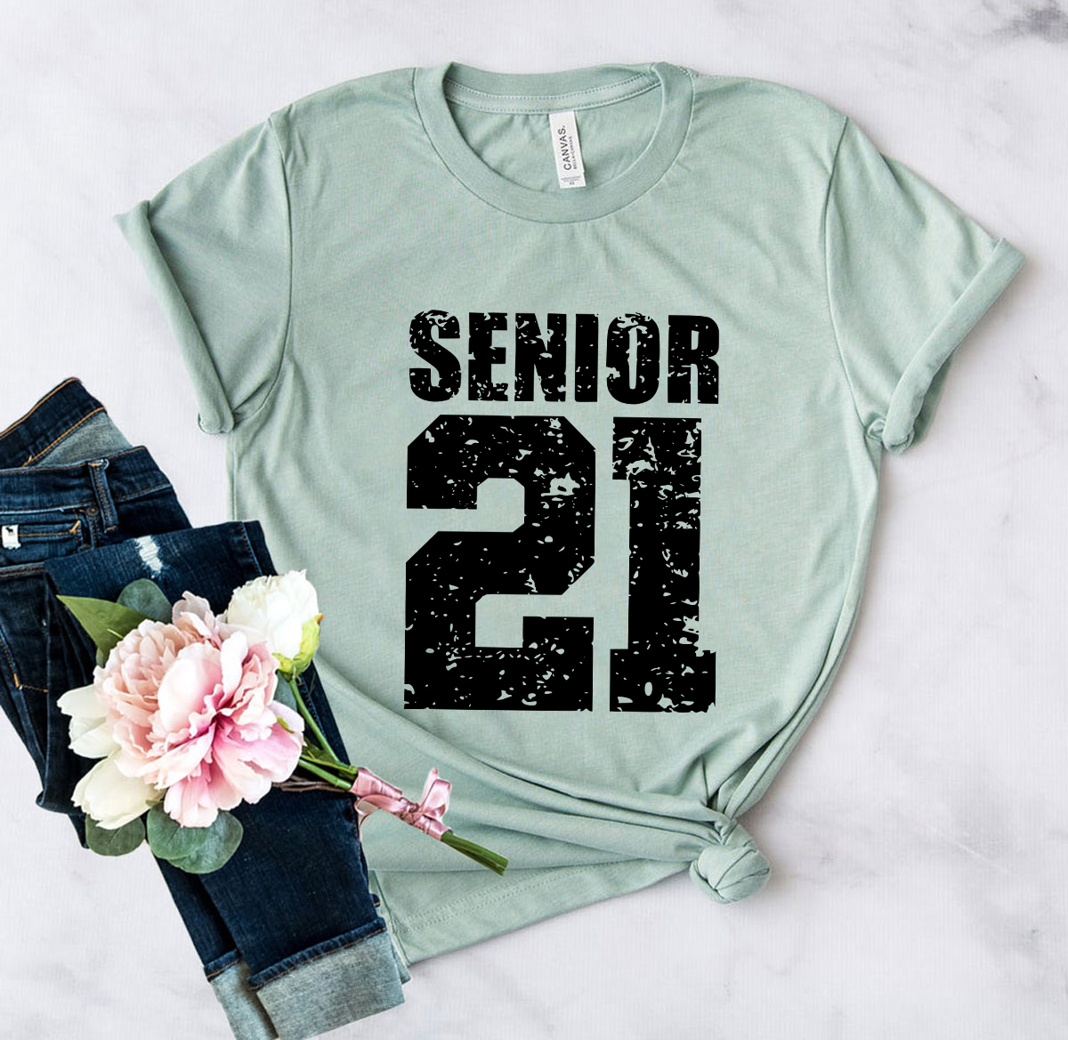 Senior 21 Shirt in various colors, showcasing its unisex design and high-quality fabric.