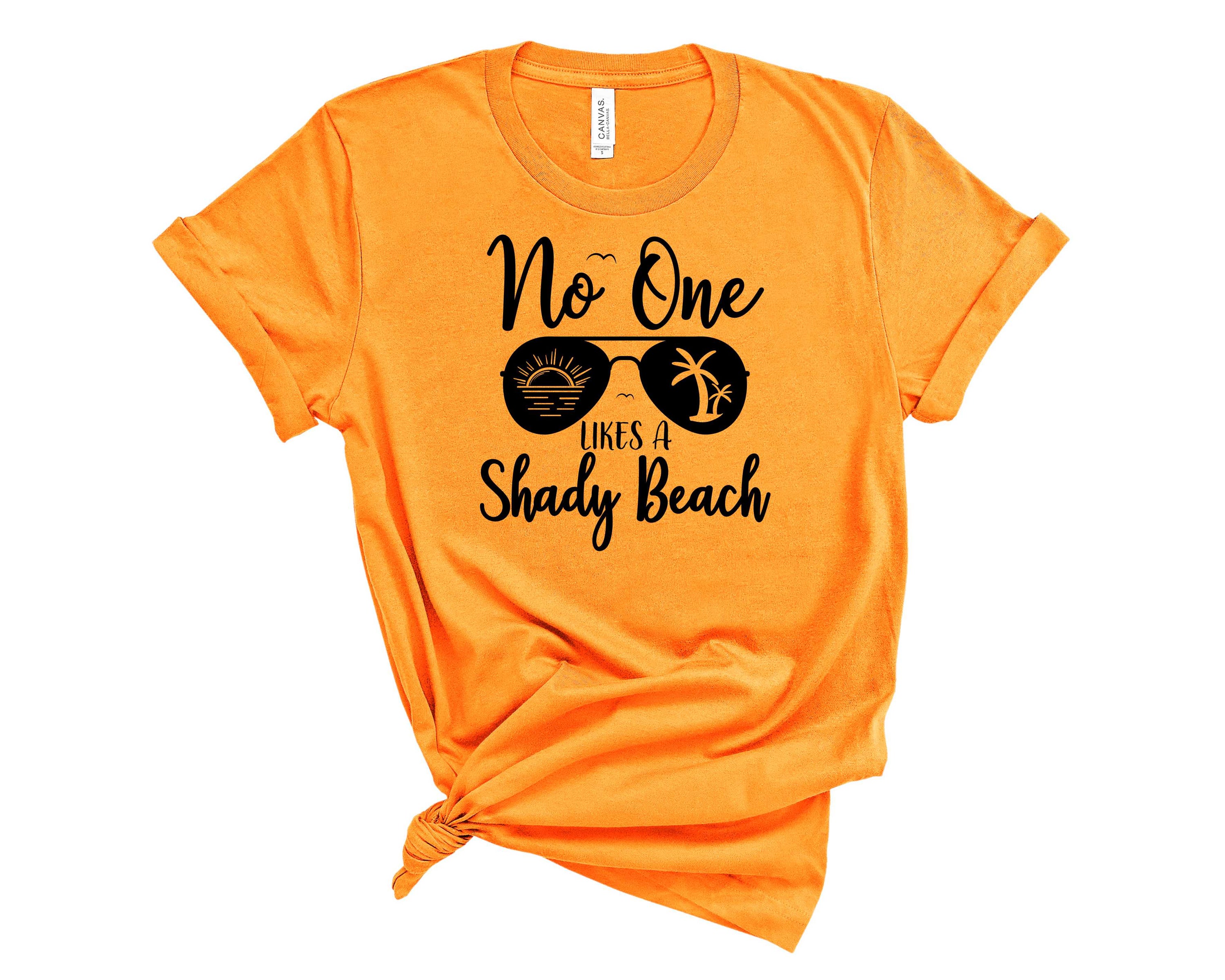 Shady Beach Graphic Tee featuring a vibrant beach-inspired design on a soft unisex t-shirt.