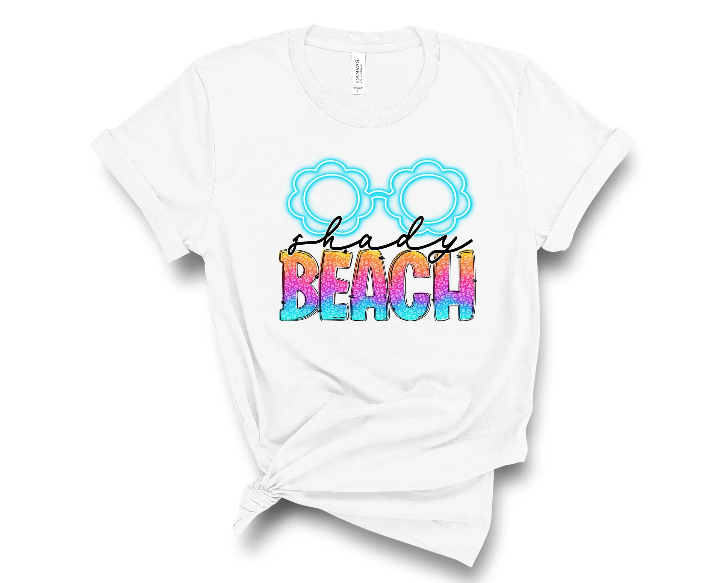 A stylish unisex Shady Beach Graphic Tee featuring a vibrant beach-themed design, perfect for casual wear.