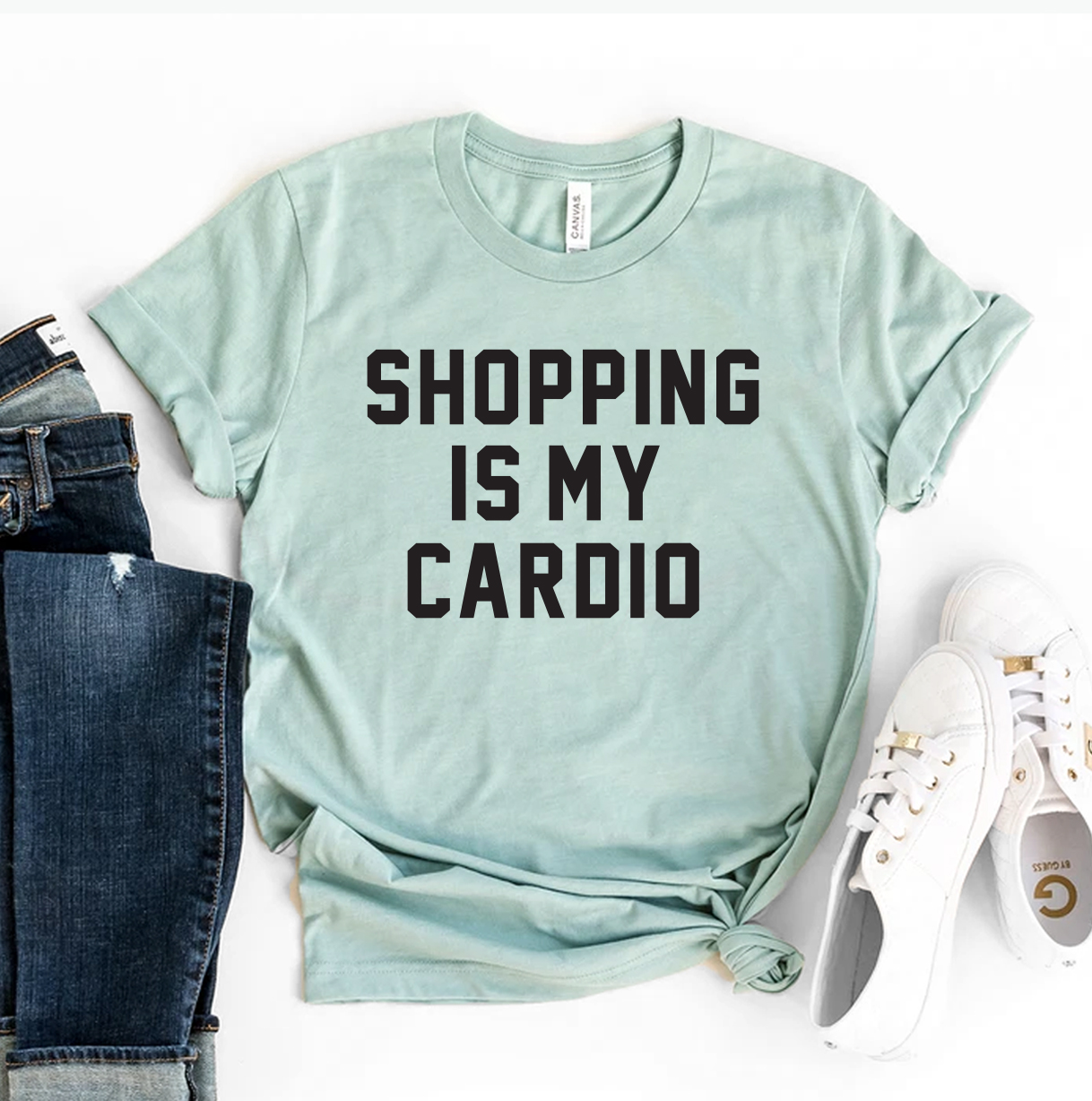 A stylish 'Shopping Is My Cardio' T-shirt made from premium ring spun cotton, featuring a vibrant flex print design.