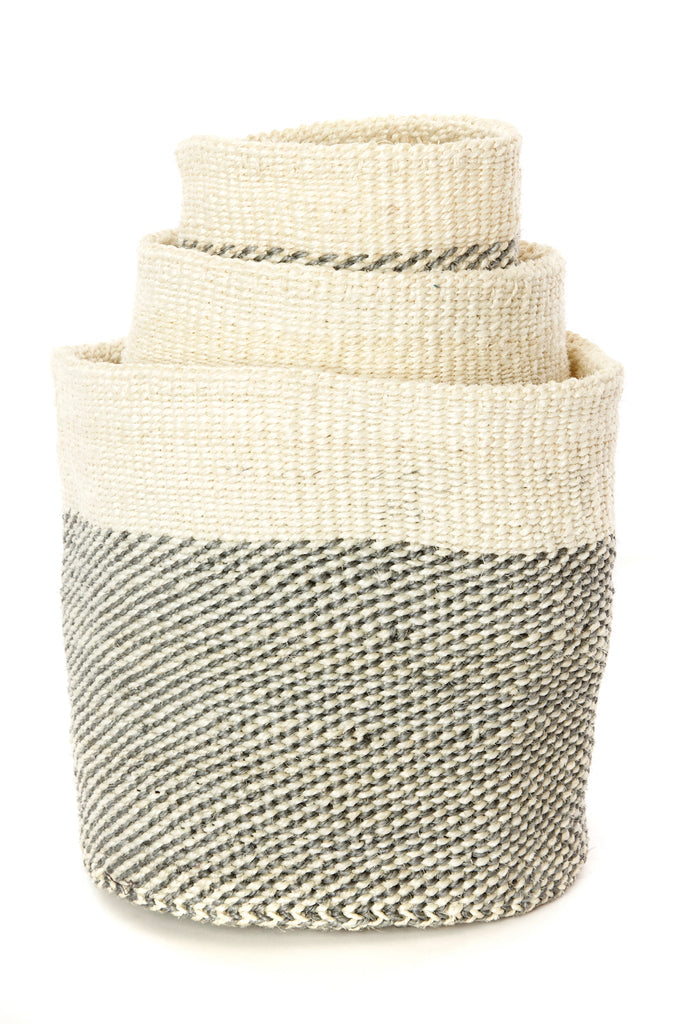 Set of three handwoven Sisal African planter and storage baskets in varying sizes, showcasing natural fibers and vibrant colors.