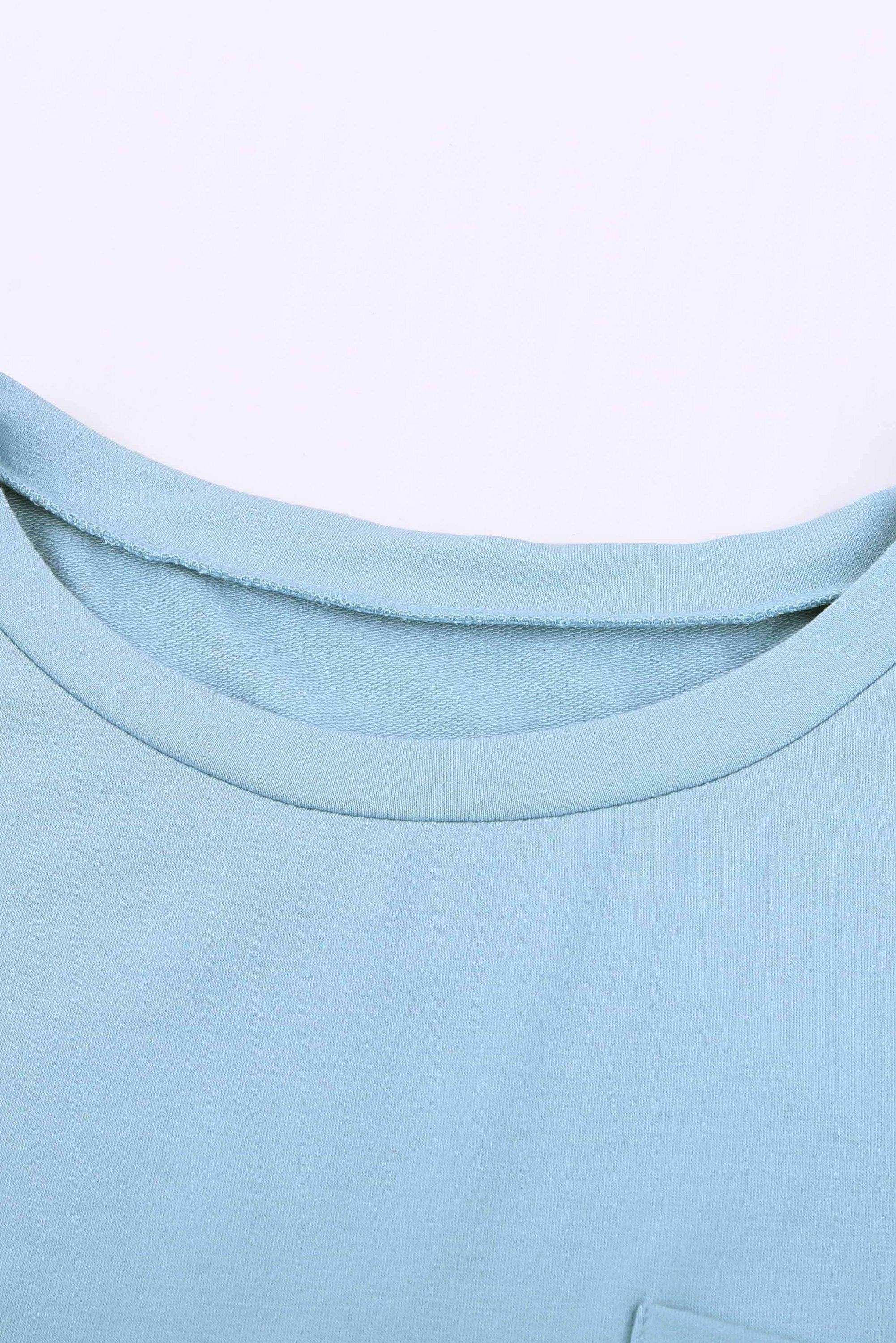 Sky Blue Knit Pocketed Side Slits Short Sleeve Tee featuring a relaxed fit, bust pocket, and side slits, perfect for summer wear.