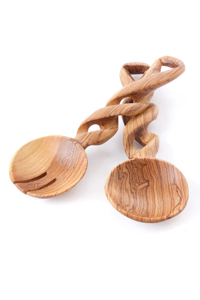 Small olive wood salad server with a seamless spiral handle, handcrafted by Kenyan artisans, showcasing unique grain patterns.