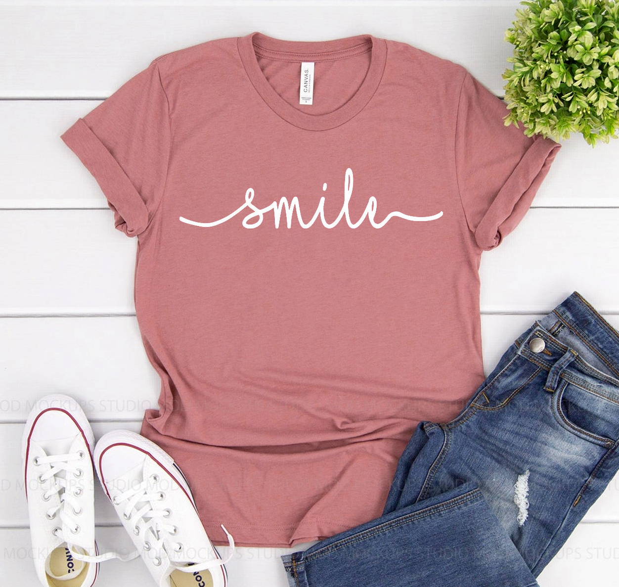 A classic unisex Smile T-shirt made from soft airlume cotton, displayed in various sizes.