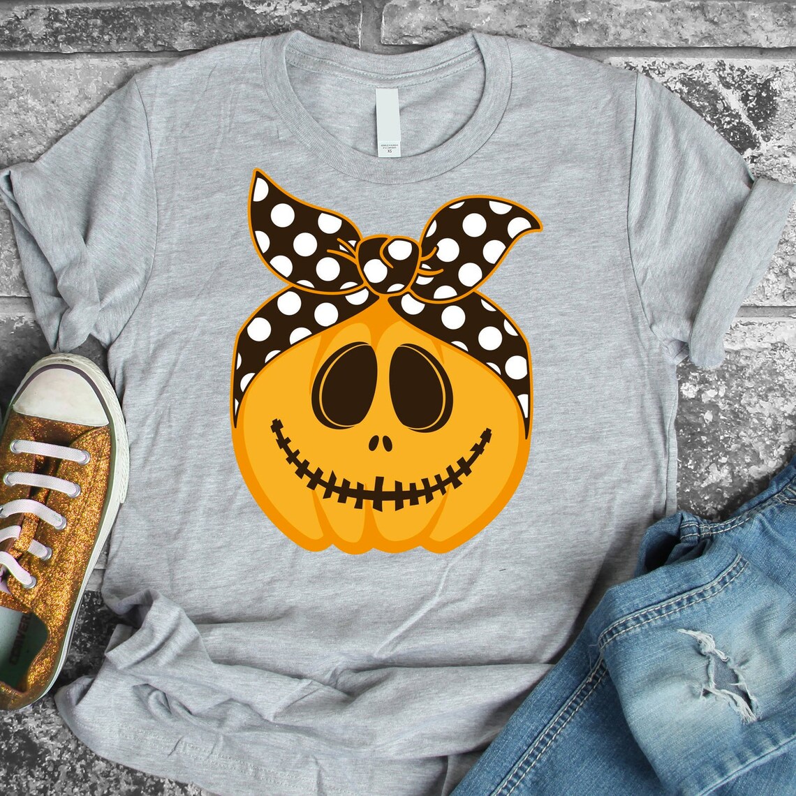 Smiling Pumpkin Halloween T-shirt featuring a cheerful pumpkin design on a premium cotton fabric.