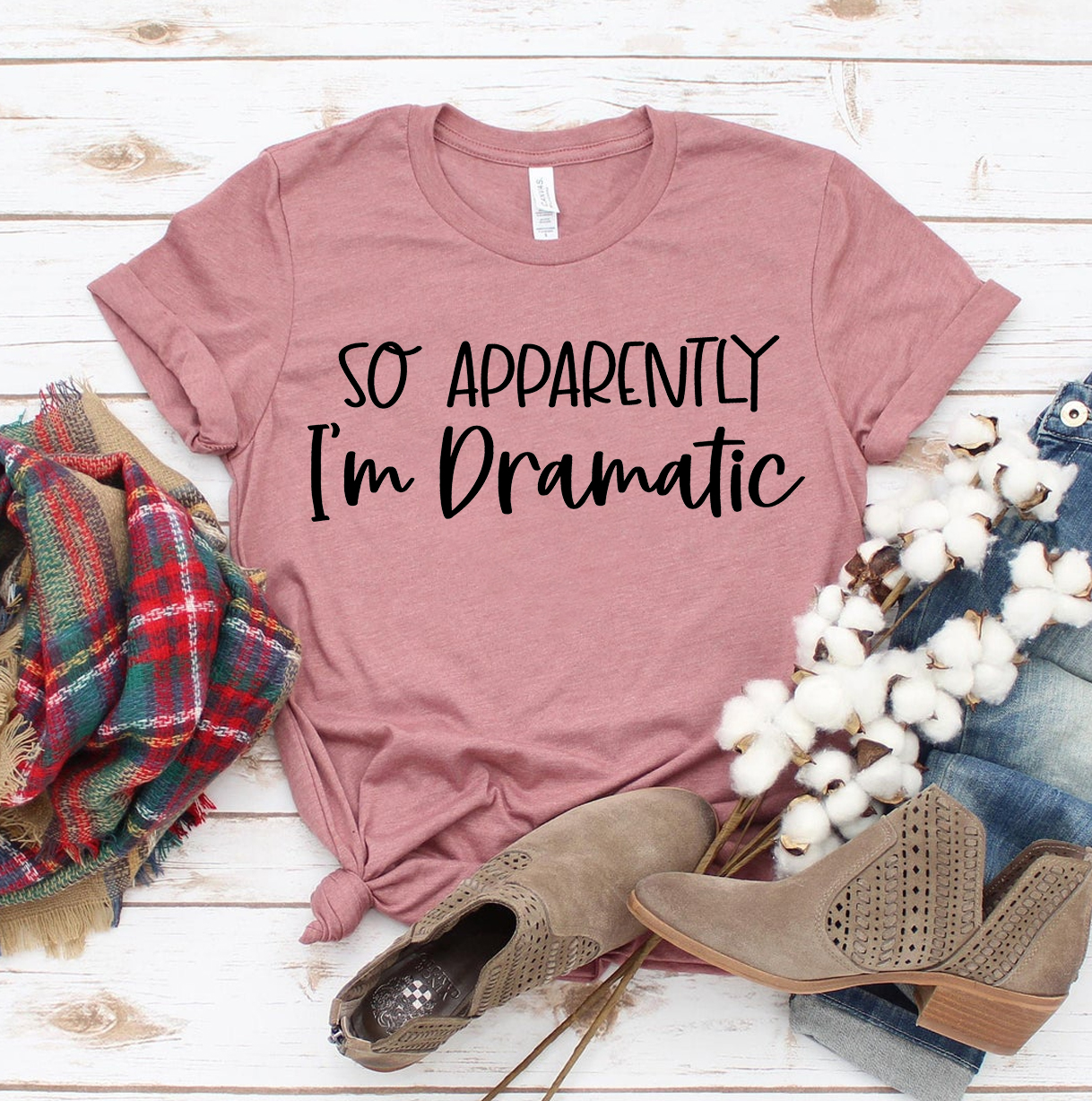 A stylish black T-shirt featuring the phrase 'So Apparently I'm Dramatic' in bold white text, made from premium ring spun cotton.