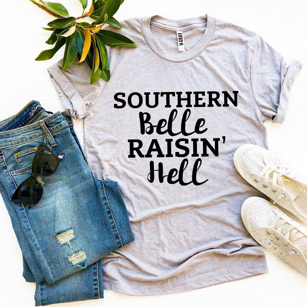 Southern Belle Raisin’ Hell T-shirt made of premium ring spun cotton with a vibrant flex print design.