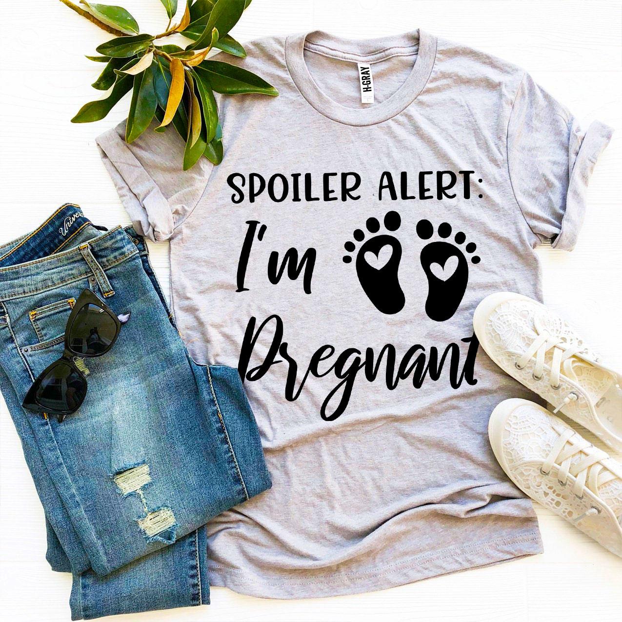 Spoiler Alert I’m Pregnant T-shirt in soft ring spun cotton, featuring a vibrant flex print design, available in various sizes.