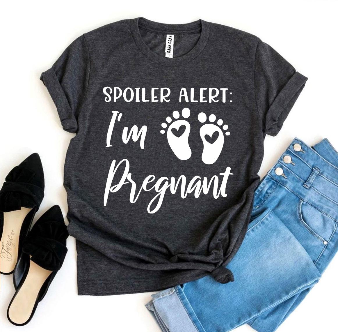 Spoiler Alert I’m Pregnant T-shirt in soft ring spun cotton, featuring a vibrant flex print design, available in various sizes.