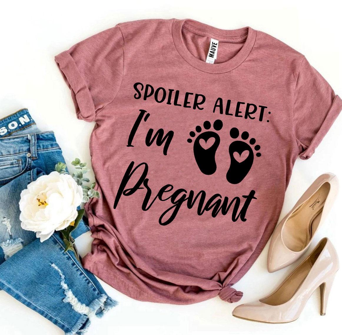 Spoiler Alert I’m Pregnant T-shirt in soft ring spun cotton, featuring a vibrant flex print design, available in various sizes.