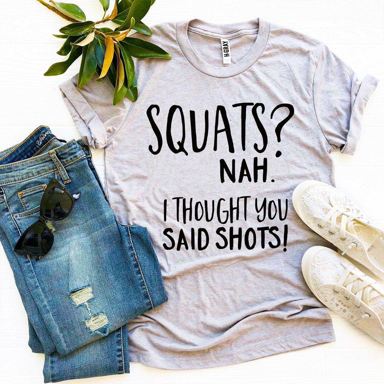 A humorous t-shirt featuring the slogan 'Squats? Nah’ I Thought You Said Shots!' made from premium ring spun cotton.