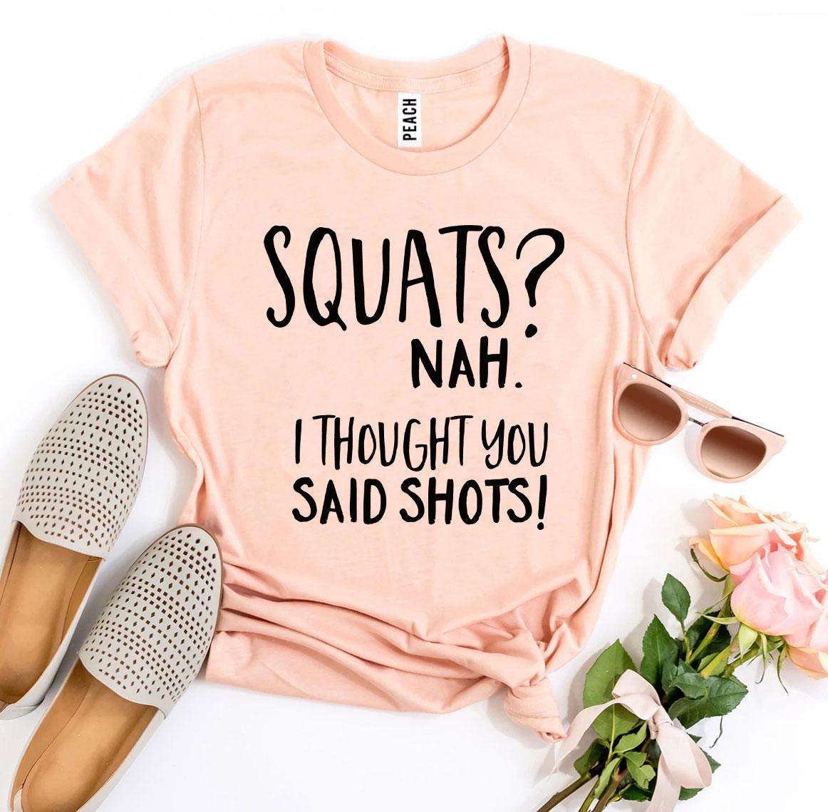 A humorous t-shirt featuring the slogan 'Squats? Nah’ I Thought You Said Shots!' made from premium ring spun cotton.