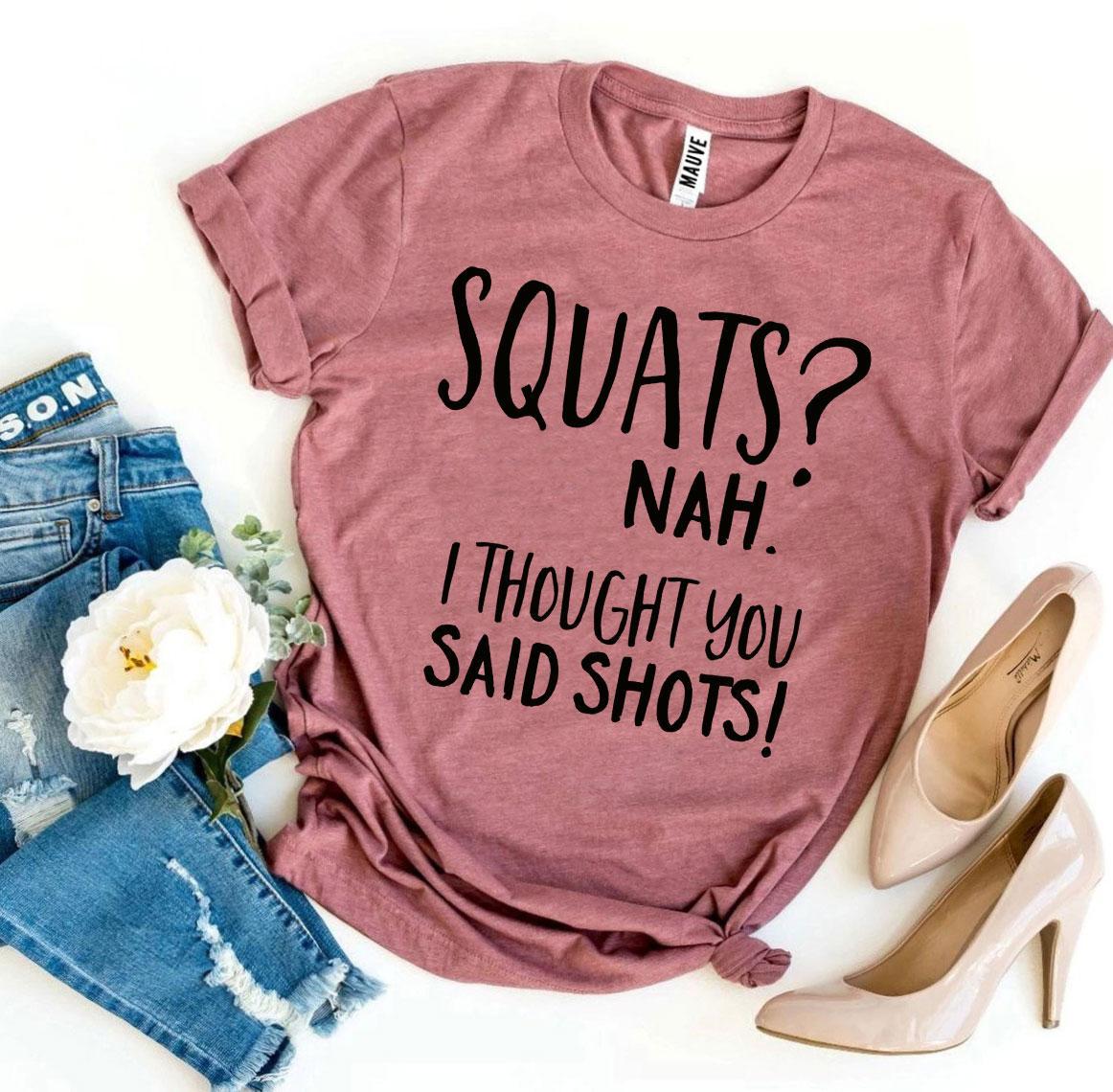 A humorous t-shirt featuring the slogan 'Squats? Nah’ I Thought You Said Shots!' made from premium ring spun cotton.