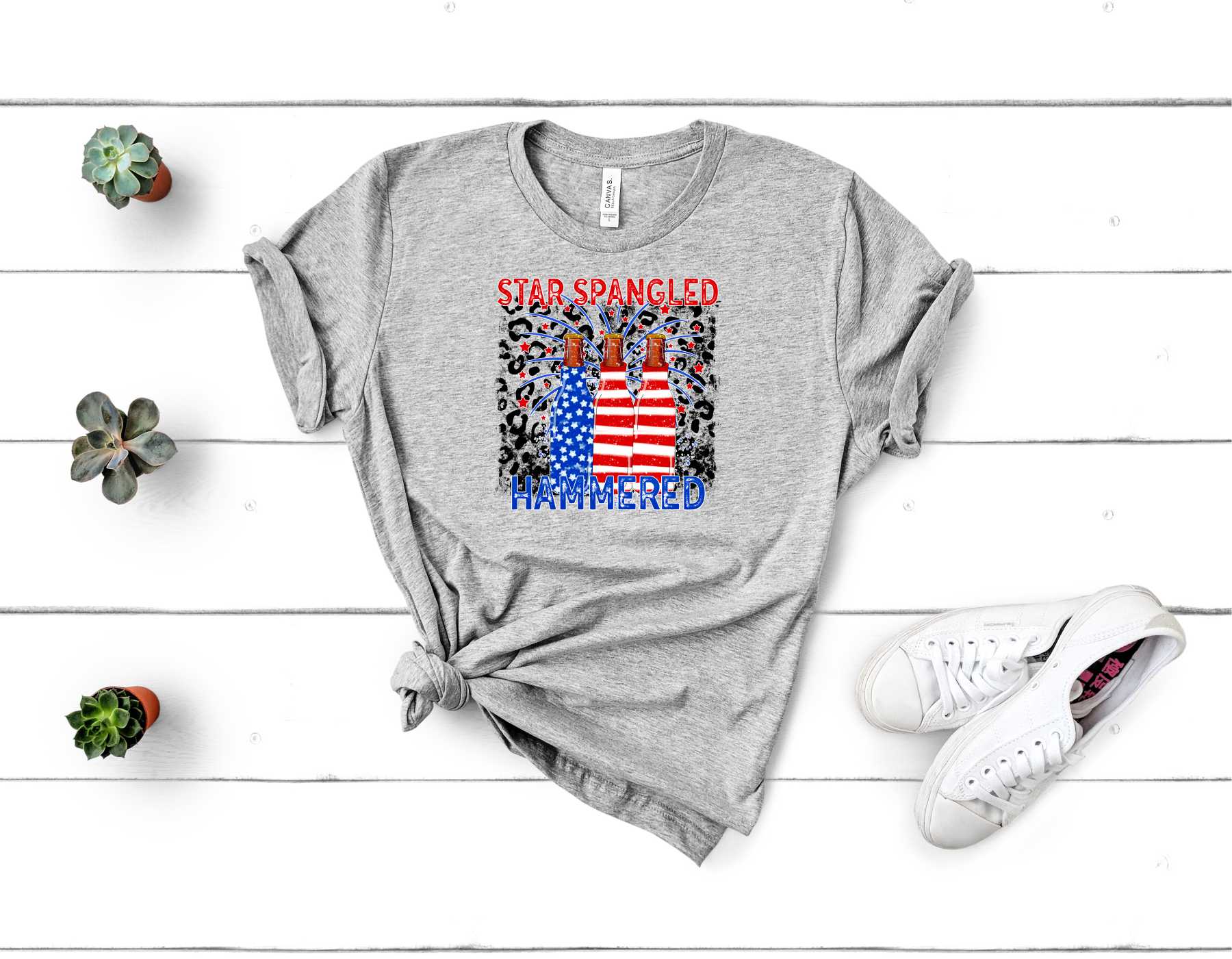 Star Spangled Hammered graphic tee featuring a bold American flag design on a soft unisex t-shirt.