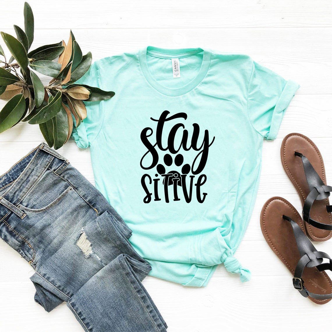 Stay Paw Sitive Shirt in various colors, showcasing its soft fabric and stylish design.