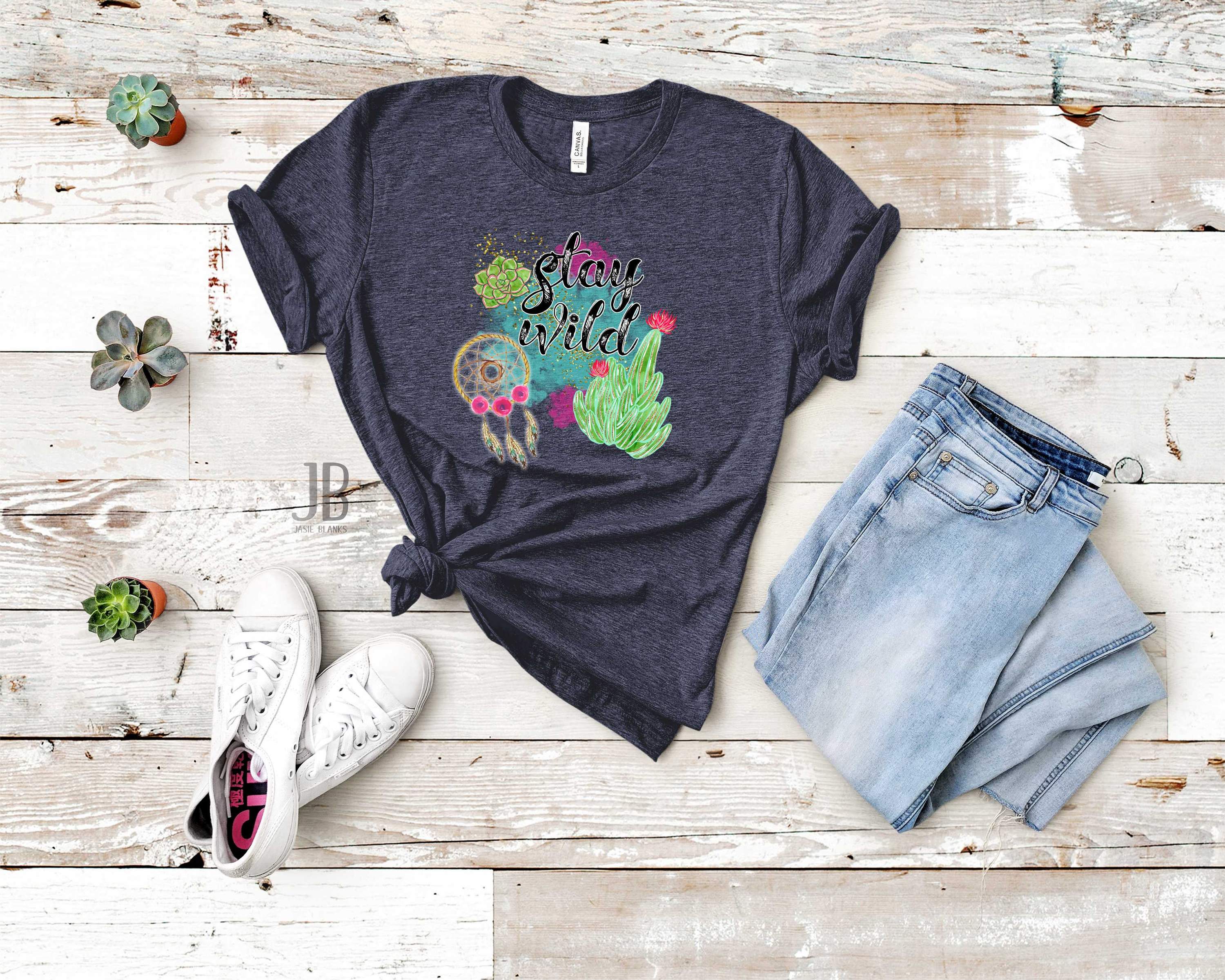 Stay Wild Graphic Tee featuring a vibrant design on a soft unisex t-shirt, perfect for casual wear.