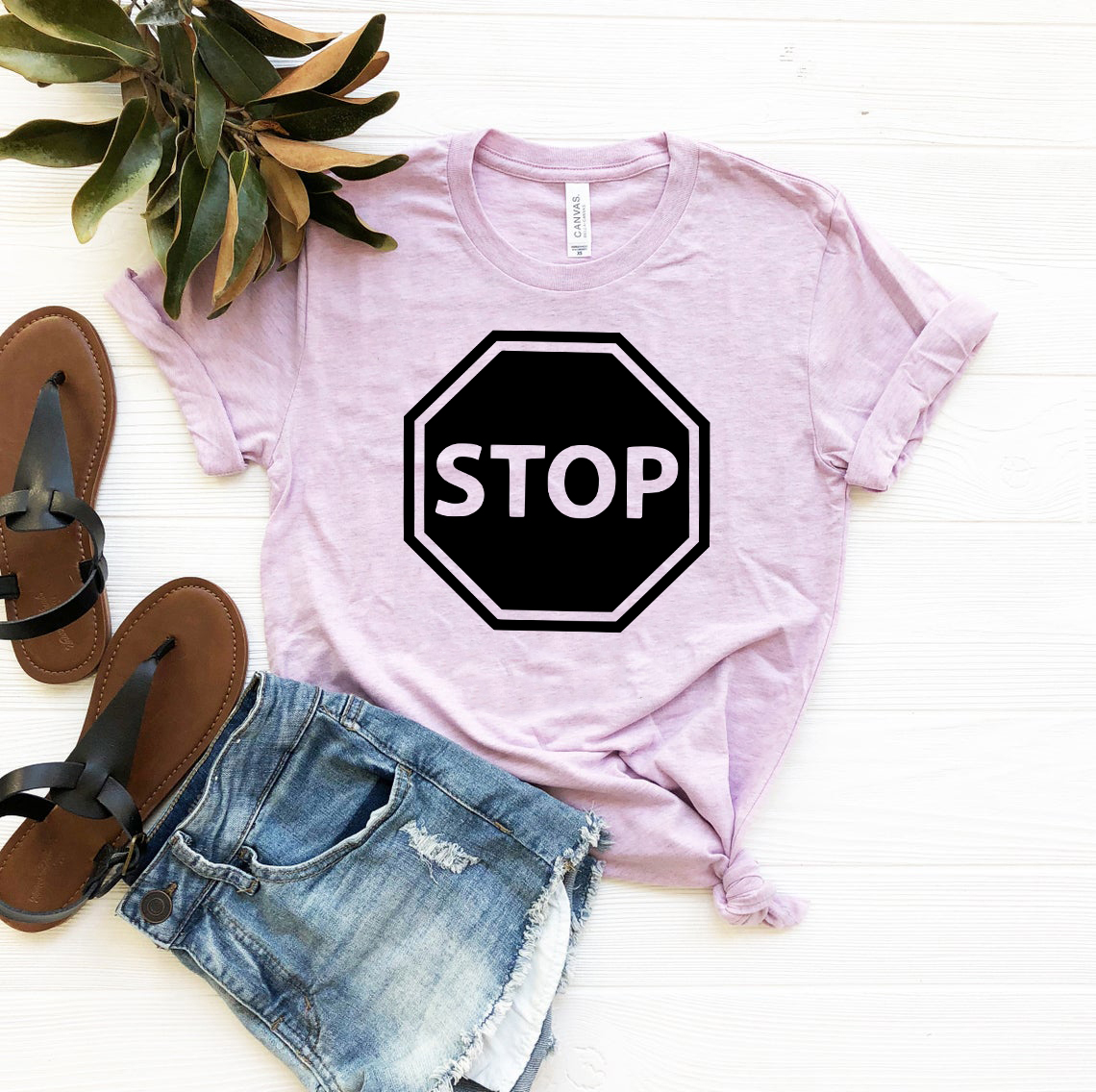 Unisex Stop Shirt made from ring spun cotton, available in multiple colors and sizes, featuring a crew neck and short sleeves.