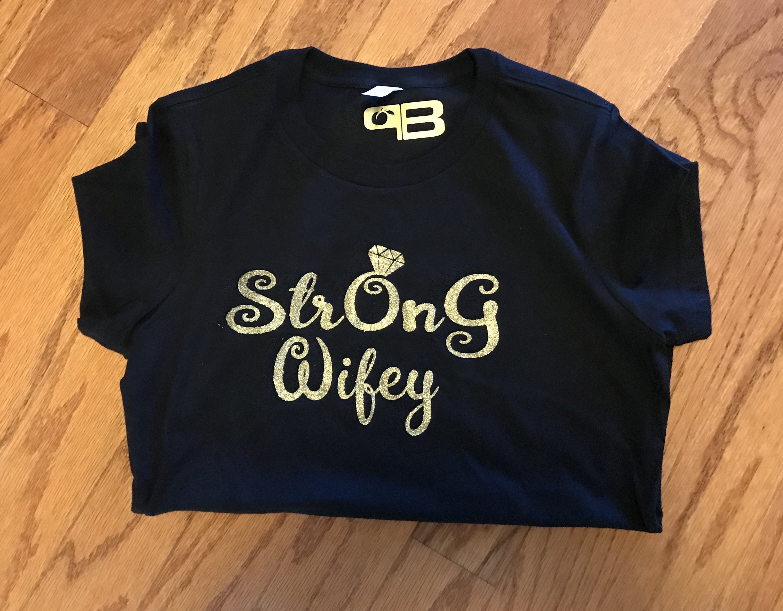 A soft and comfortable StrOnG Wifey Shirt featuring the empowering message 'Strength On God' in stylish lettering.