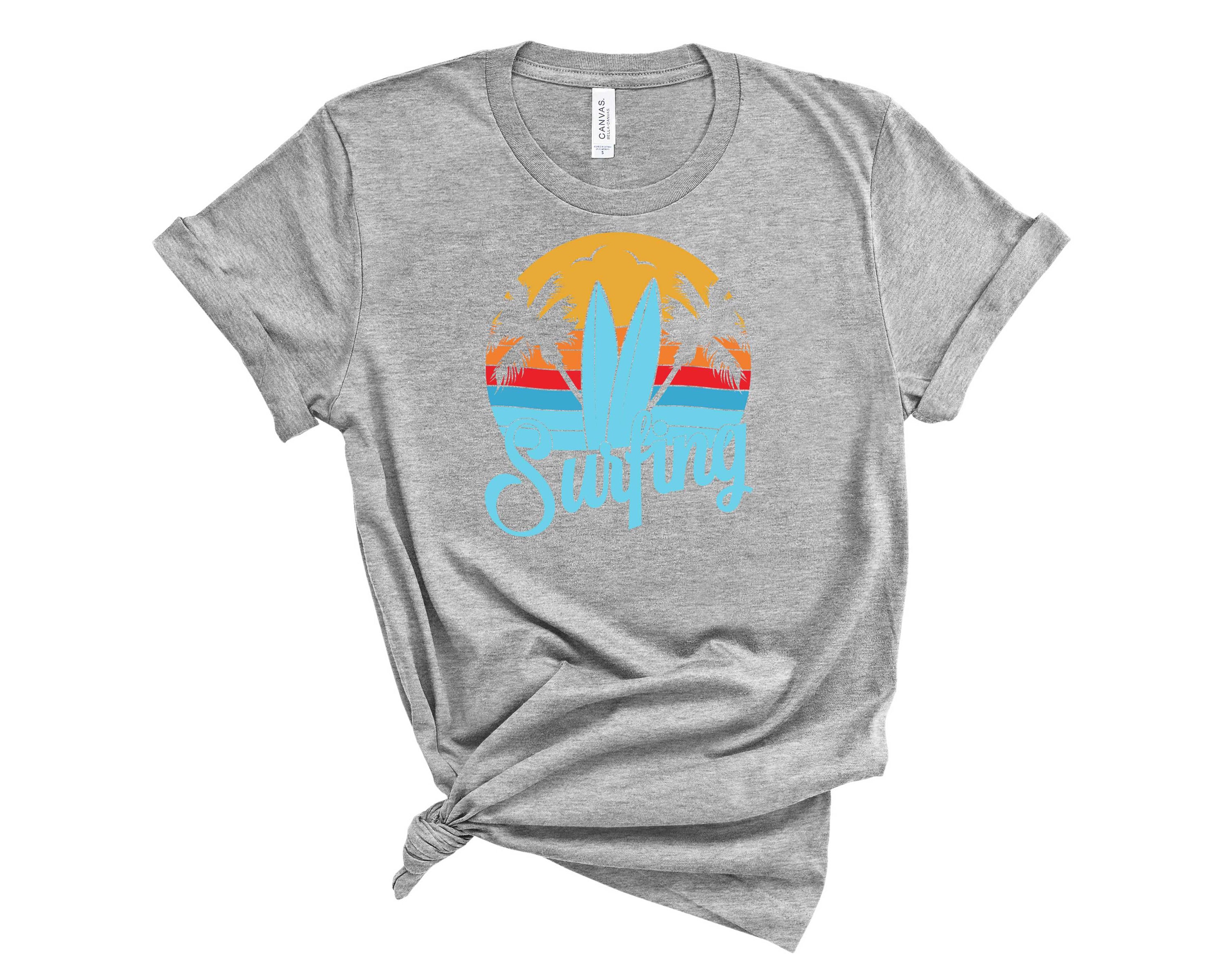 A stylish unisex Surfing Graphic Tee featuring a vibrant surfing design, perfect for beach lovers and casual wear.