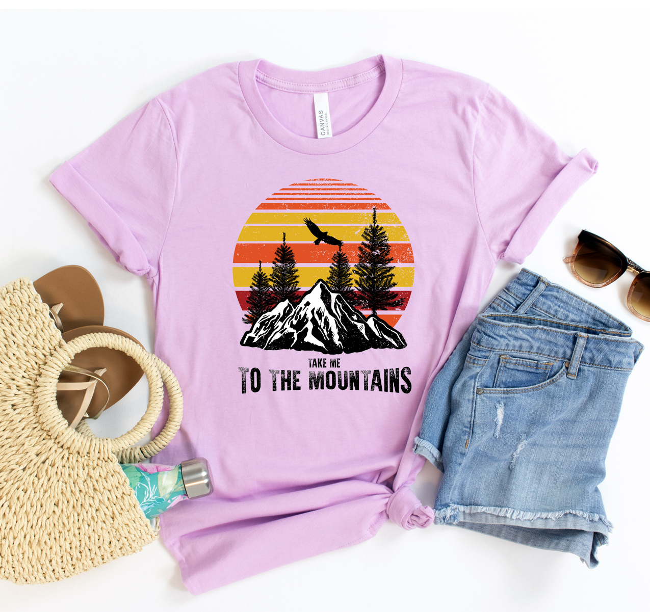 Take Me To The Mountains T-shirt in various sizes, showcasing its unisex design and soft fabric.