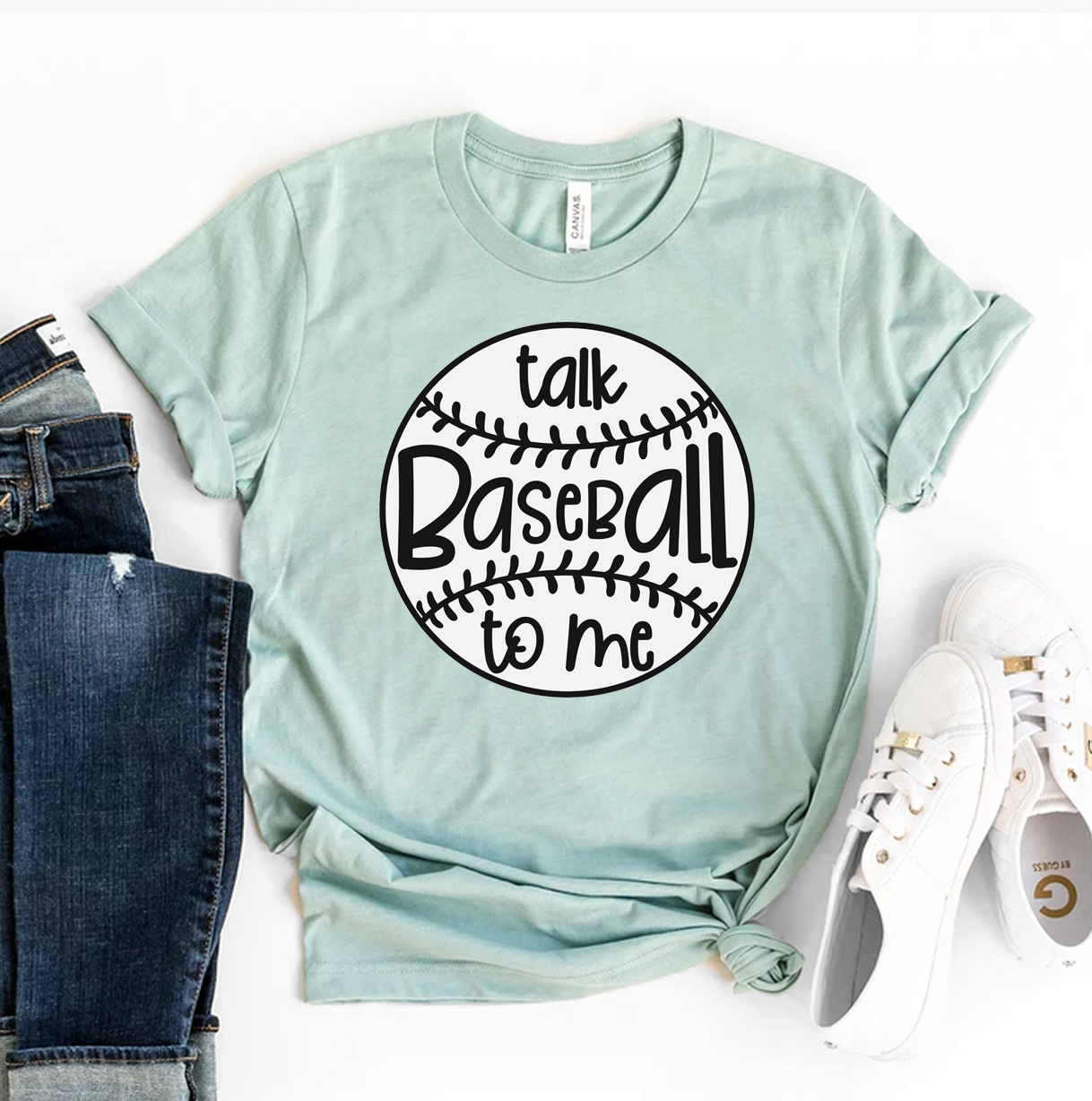 A stylish Talk Baseball To Me T-shirt made from premium ring spun cotton, featuring a playful baseball-themed design.