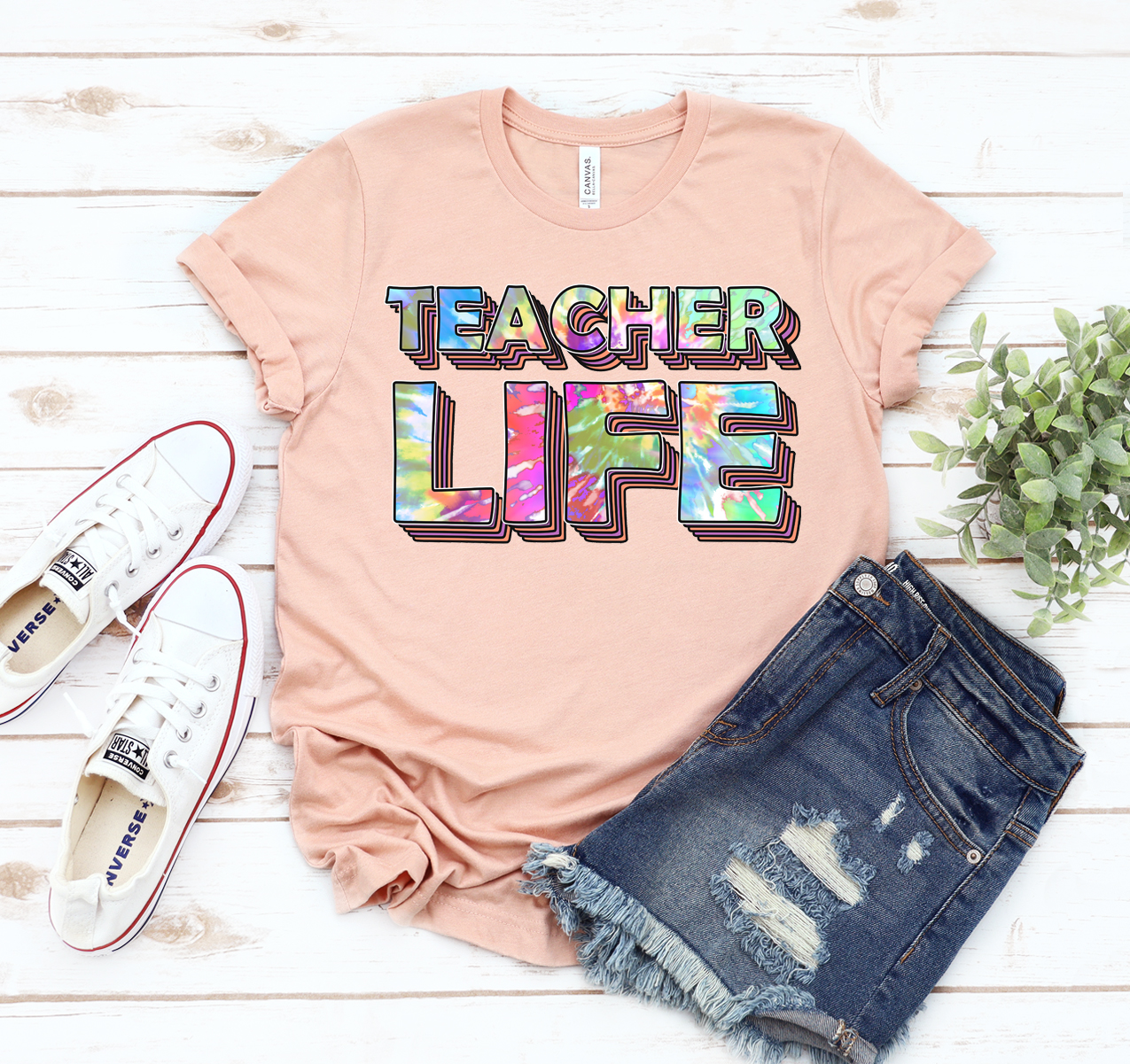 A stylish Teacher Life T-shirt made from soft, high-quality cotton, showcasing a classic unisex design suitable for all educators.