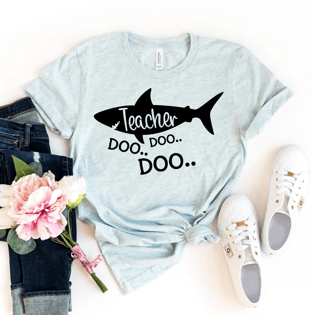 Teacher Shark Doo Doo Doo T-shirt made of premium ring spun cotton with a playful design.