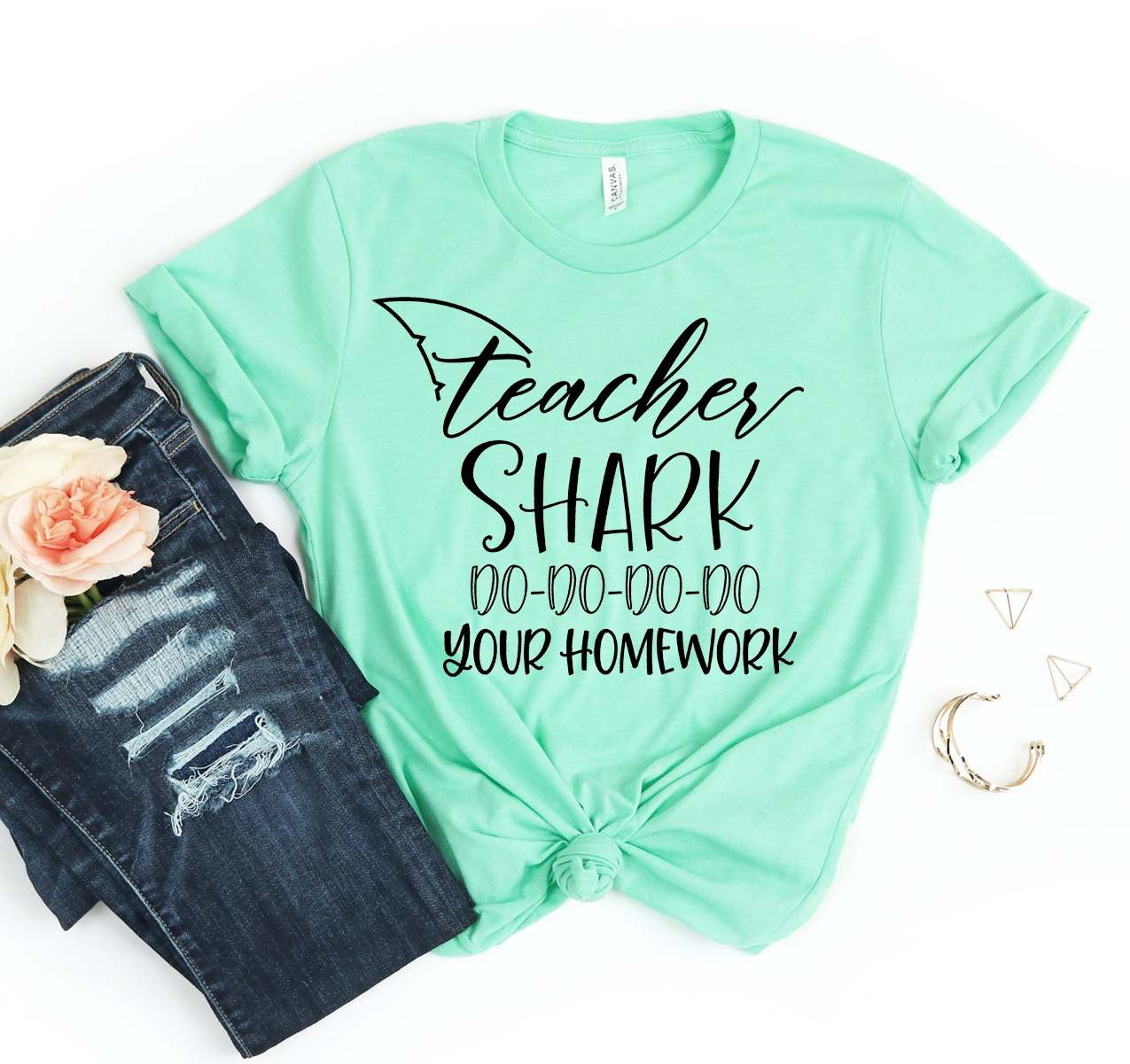 Teacher Shark T-shirt featuring a playful design, made from soft airlume combed cotton, available in various sizes.