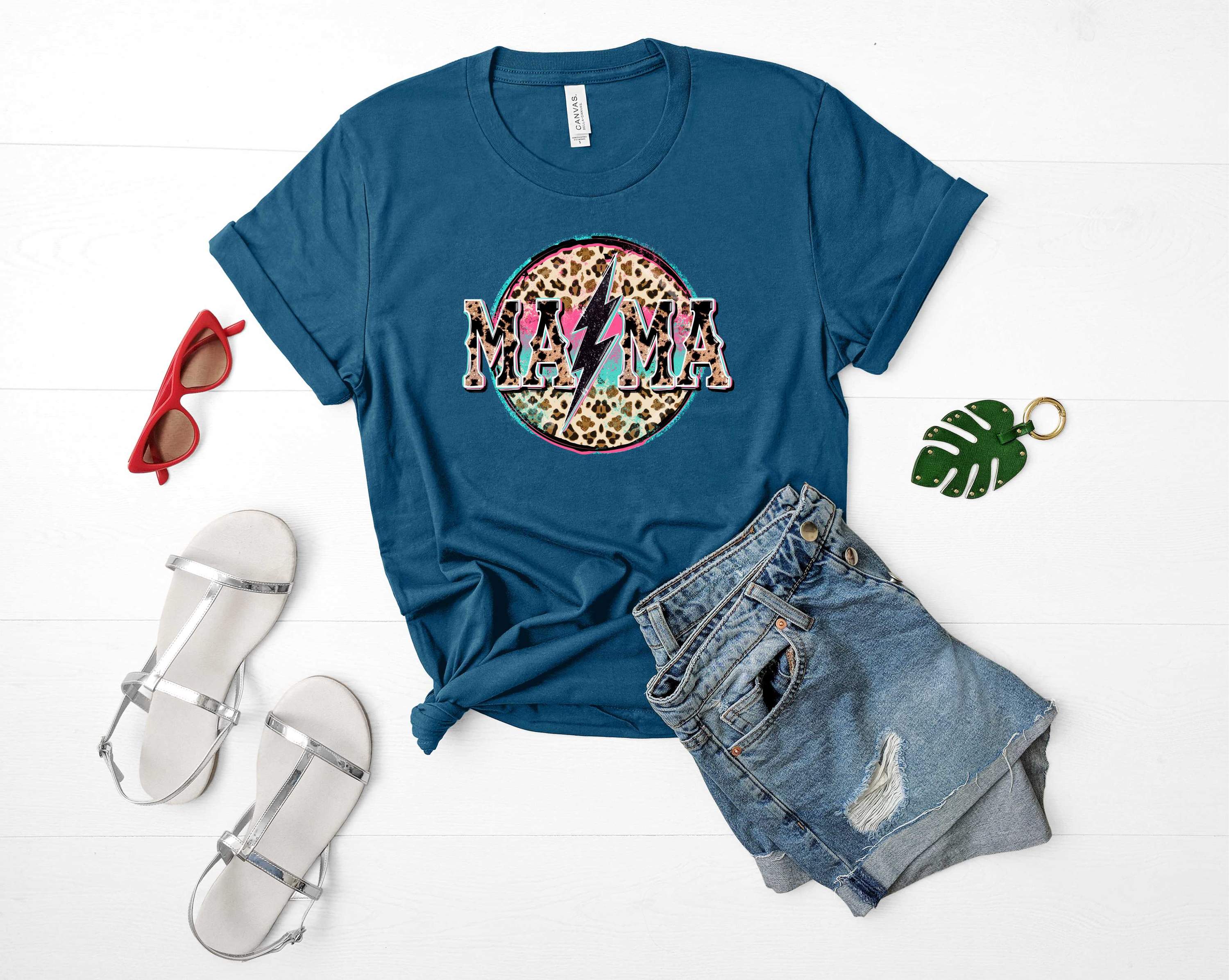 Teal and pink unisex graphic tee featuring leopard print with the word 'Mama' in stylish font.